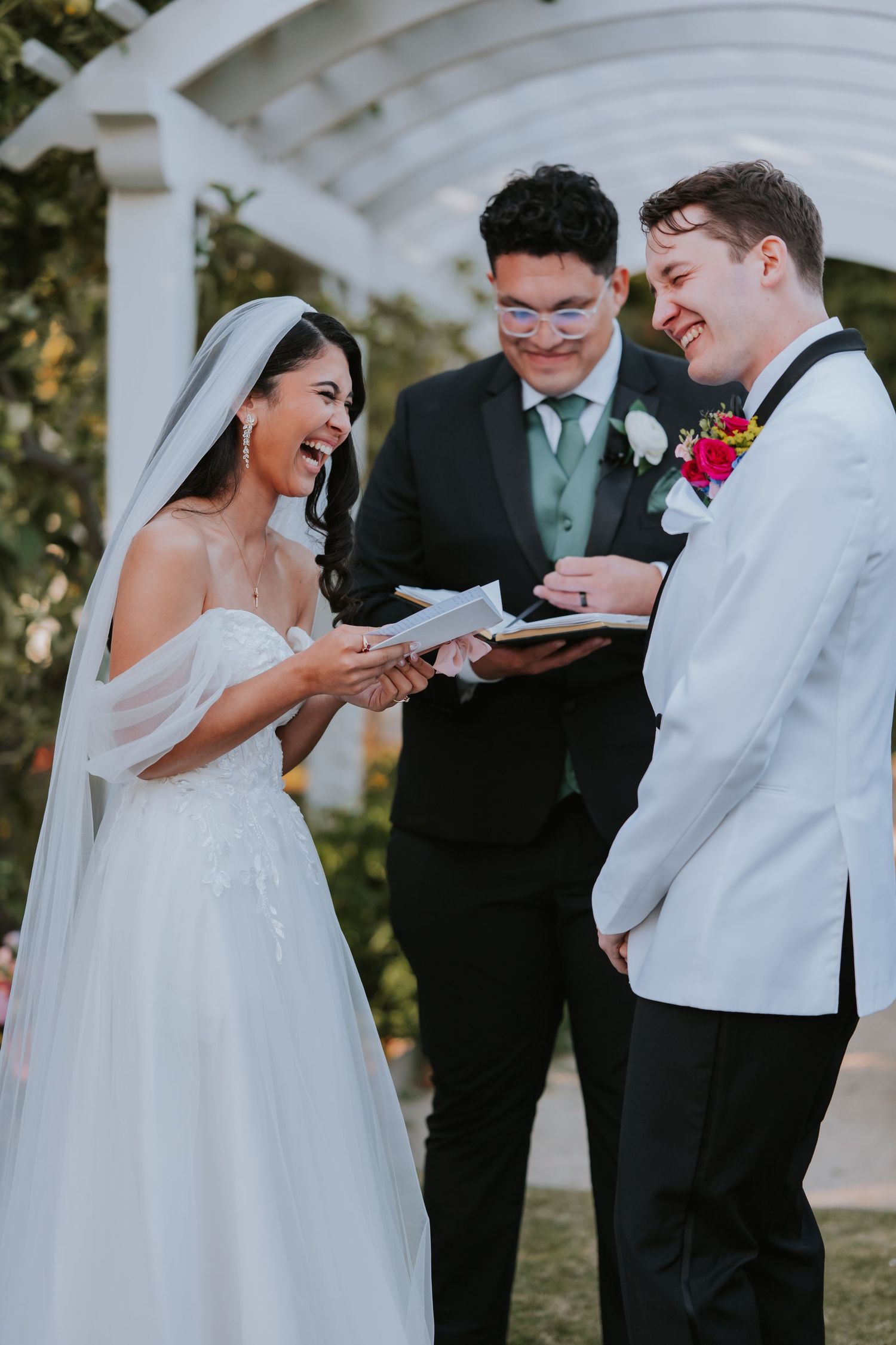 A joyful wedding ceremony sequence showing the exchange of vows under a white pergola.