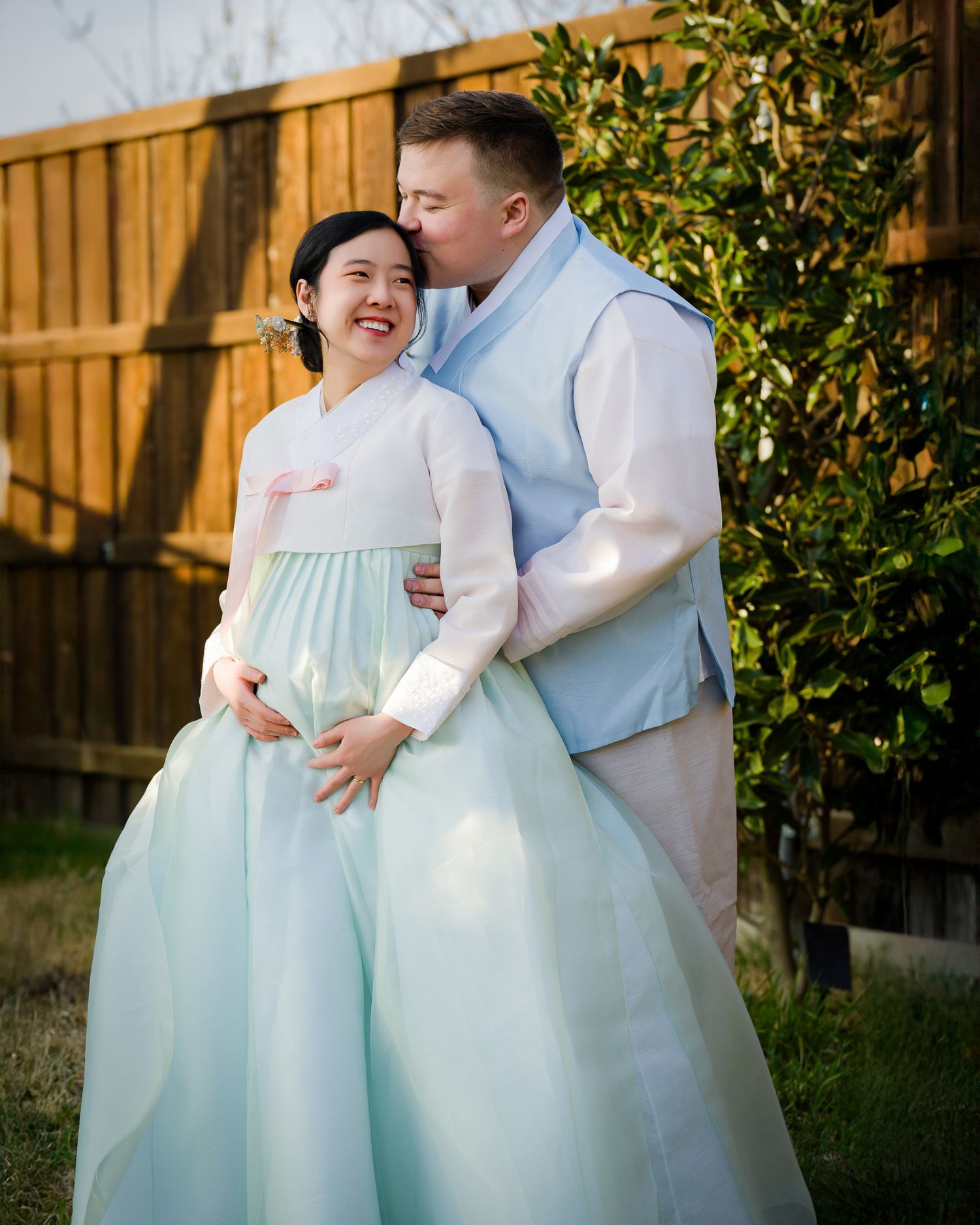 Pregnancy portraits of a couple wearing HanBok ( Korean Traditional gown), the moment of soon to be a parents. Captured in a moment of their