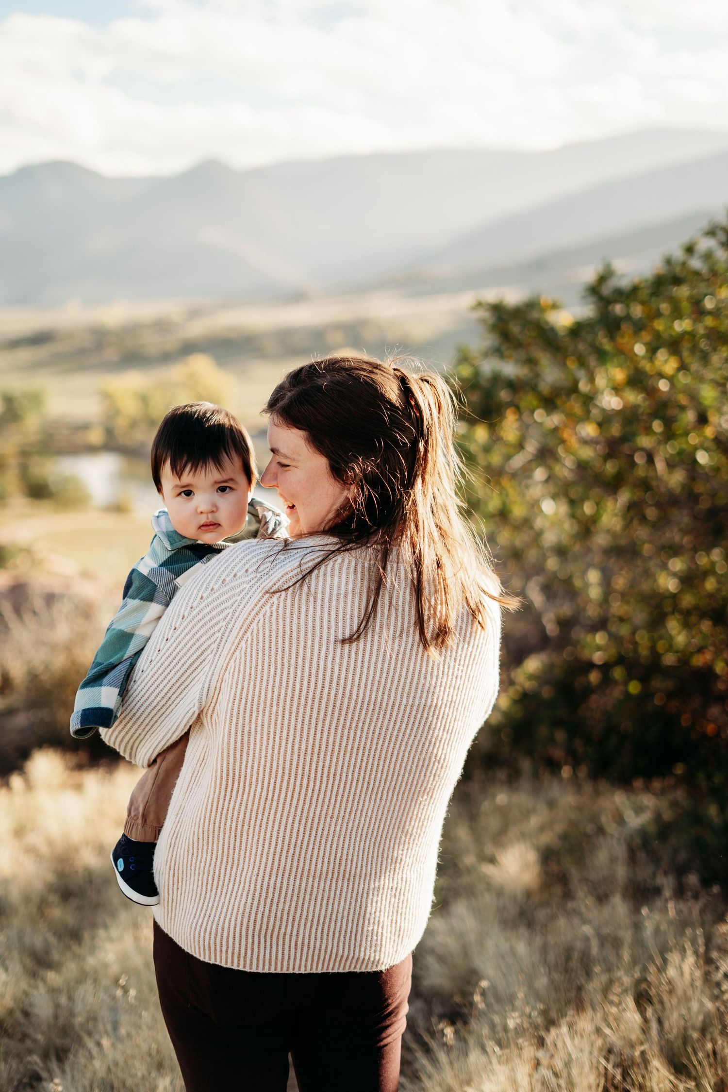 Mother and baby cuddling in photo, Denver photographer specializing in family moments.