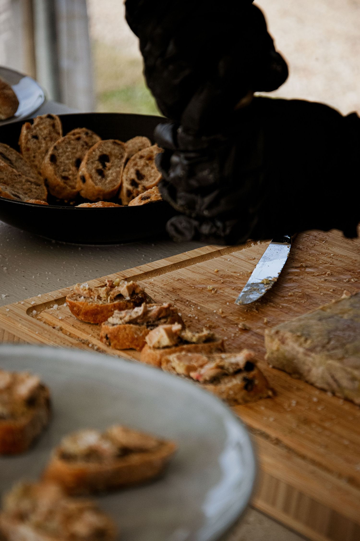 Sequence of progressive close-up shots showing chocolate chip cookies arranged on rustic wooden boards and white plates.
