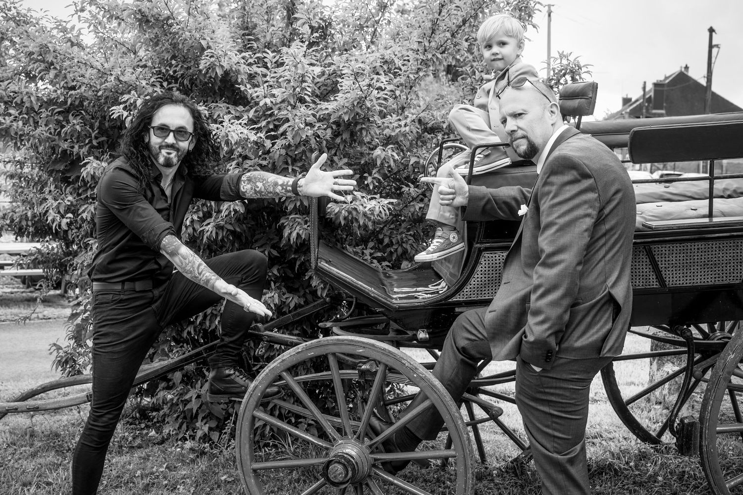 A series of black and white photographs showing people interacting with a historic cannon in an outdoor setting.