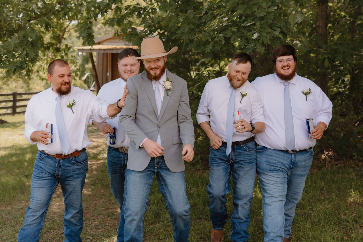A group in matching blue jeans and white shirts laughing together outdoors in a casual photo series.