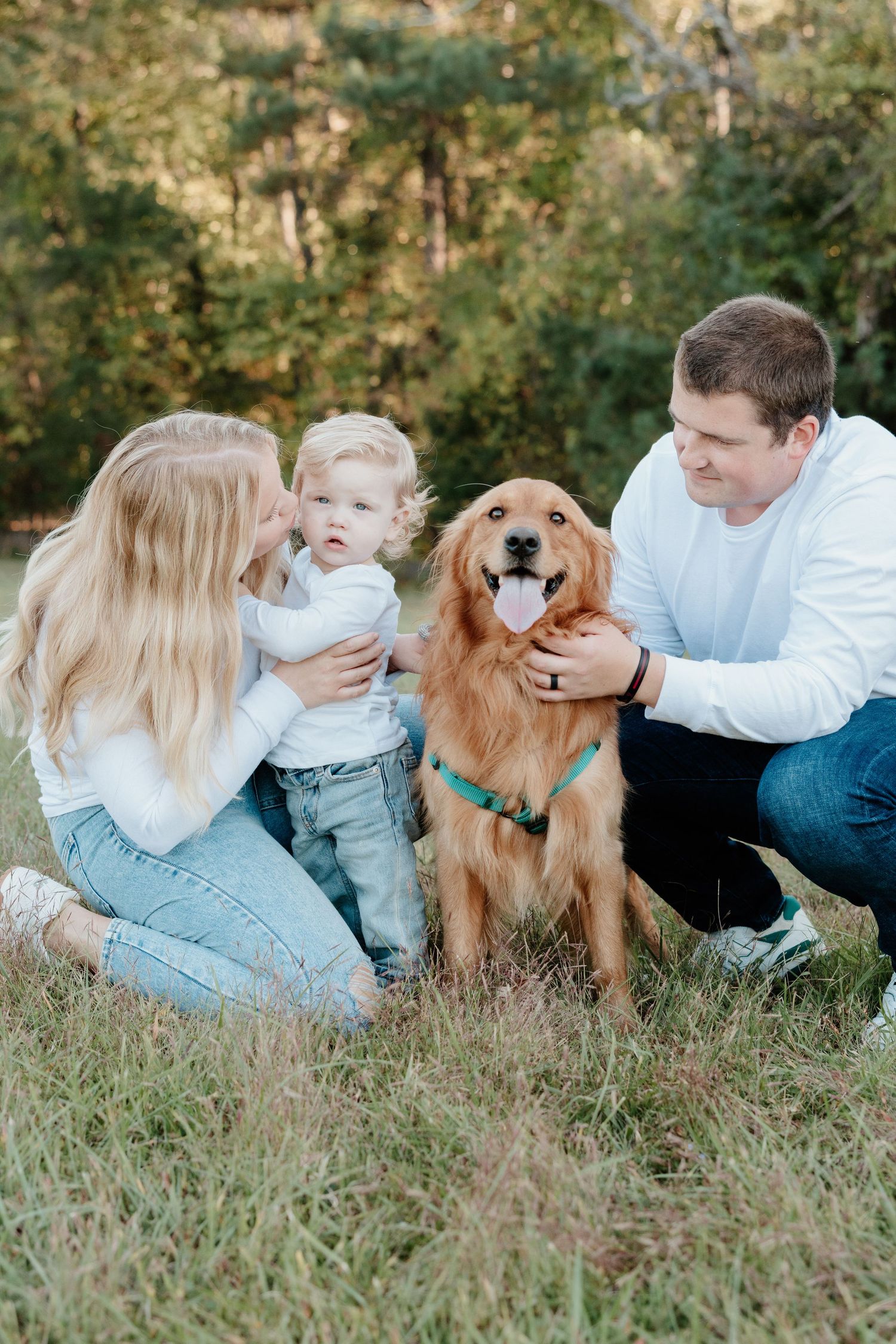A family and their golden retriever dog lying together on grass in a series of casual outdoor portrait photos.