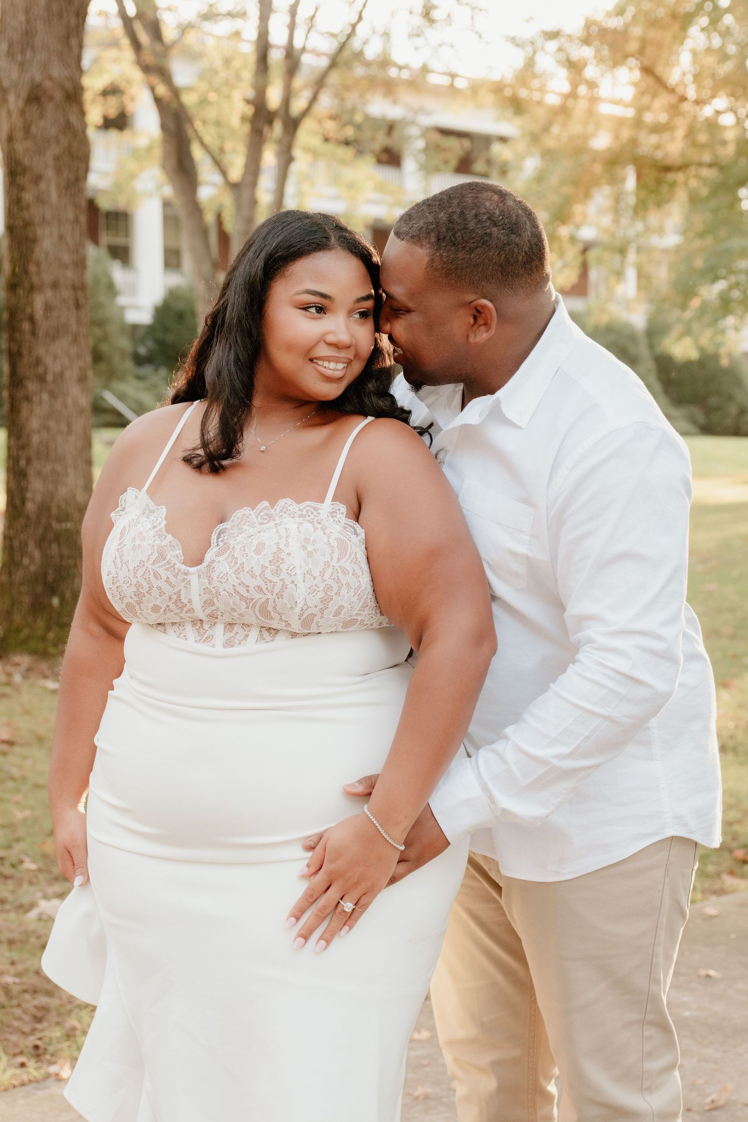 A romantic photo series showing intimate moments between a couple in white attire against a sunlit outdoor setting.