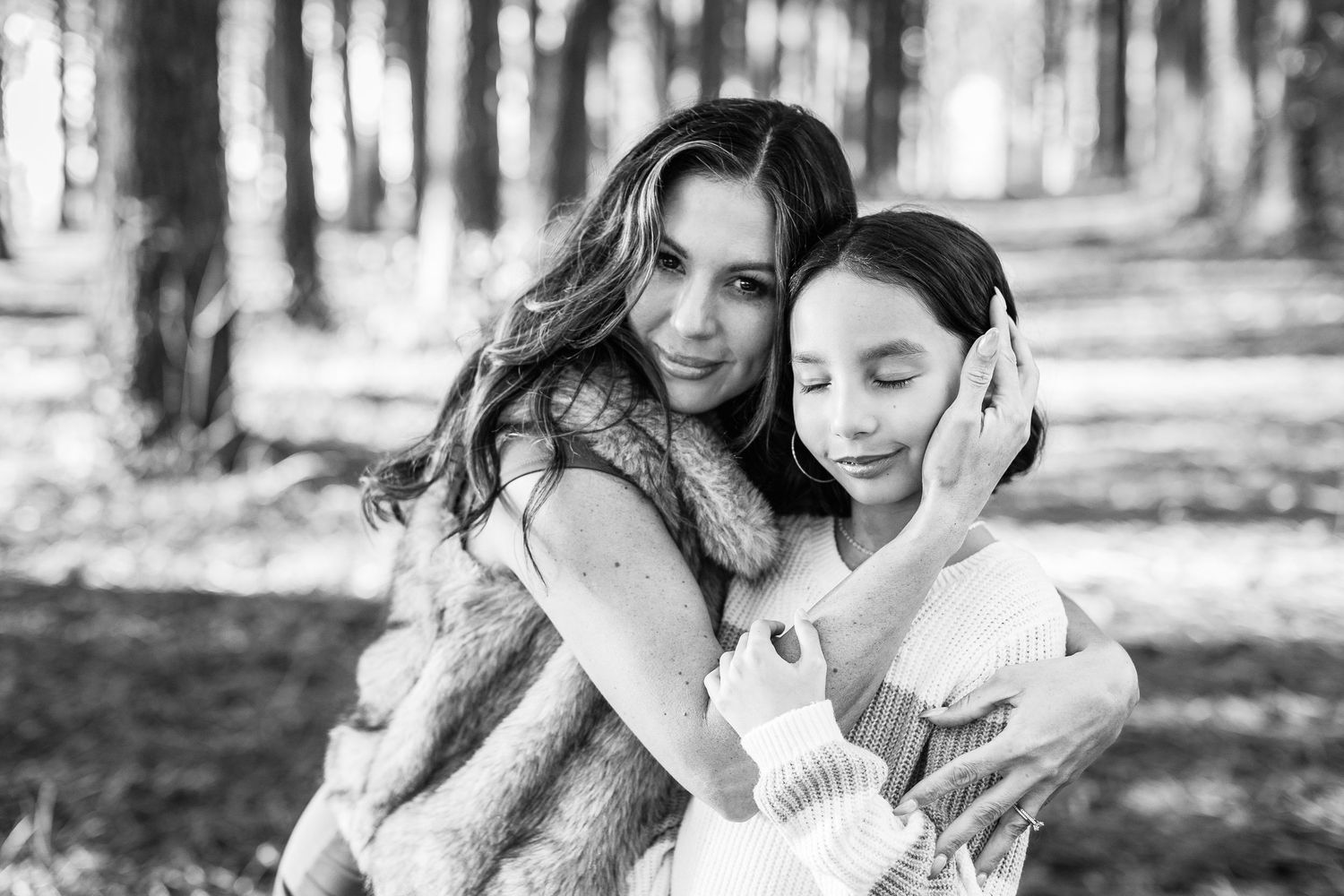 A black and white photo montage shows tender moments between mother and child in an outdoor setting.