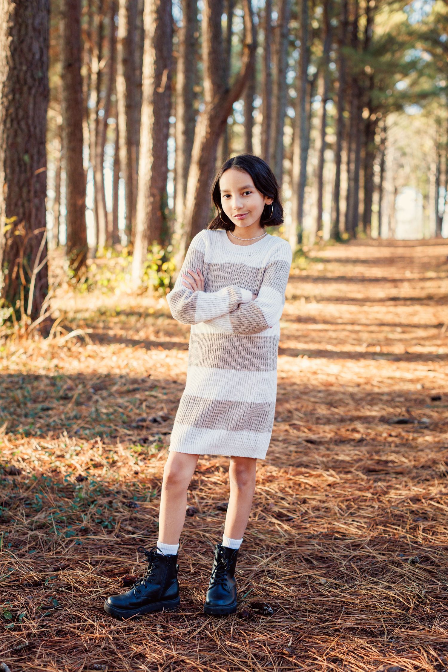 A series of photos showing someone reading a letter while standing in a sunlit pine forest with fallen needles.