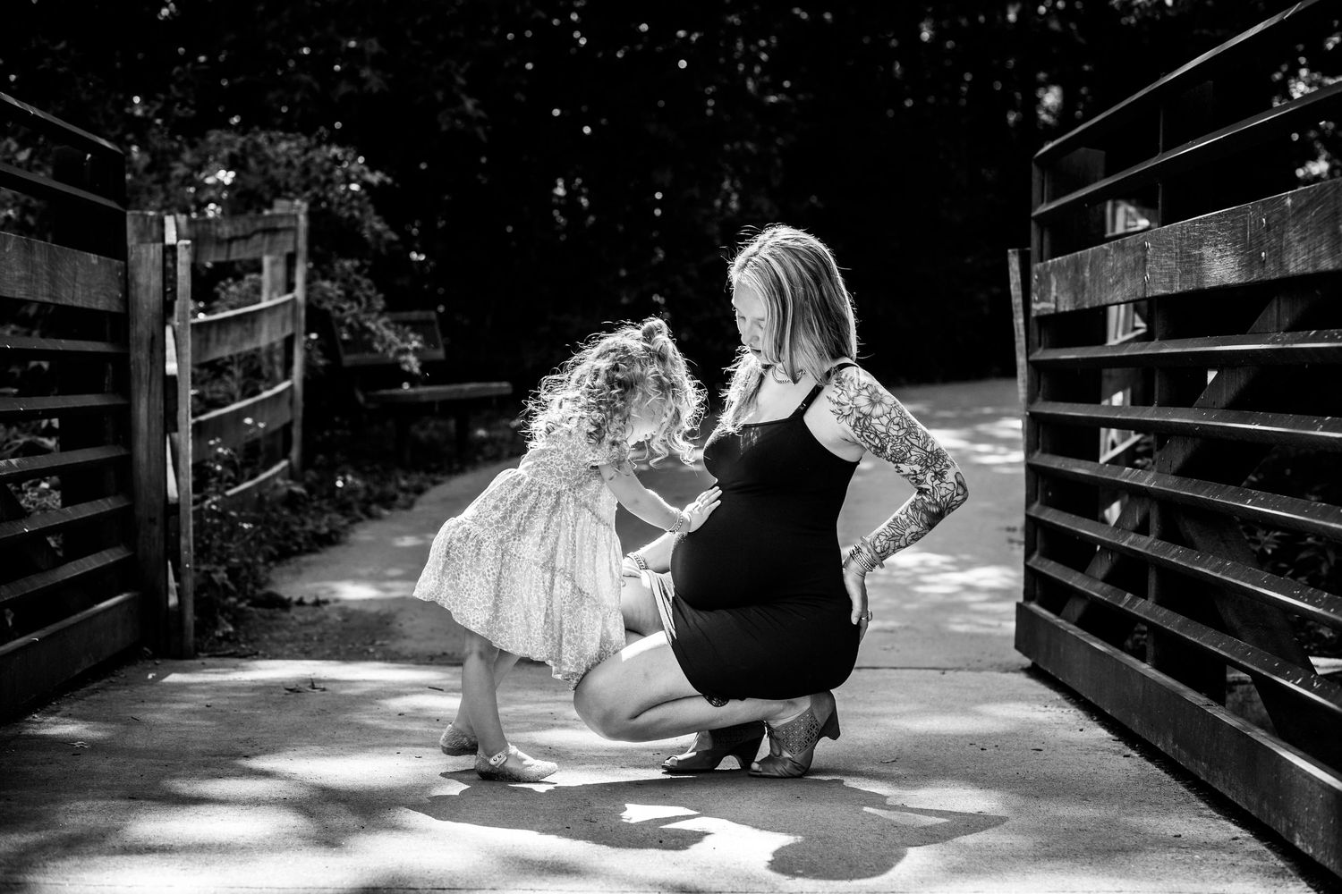 A sequence of black and white photos shows someone sliding down a wooden ramp on their stomach.