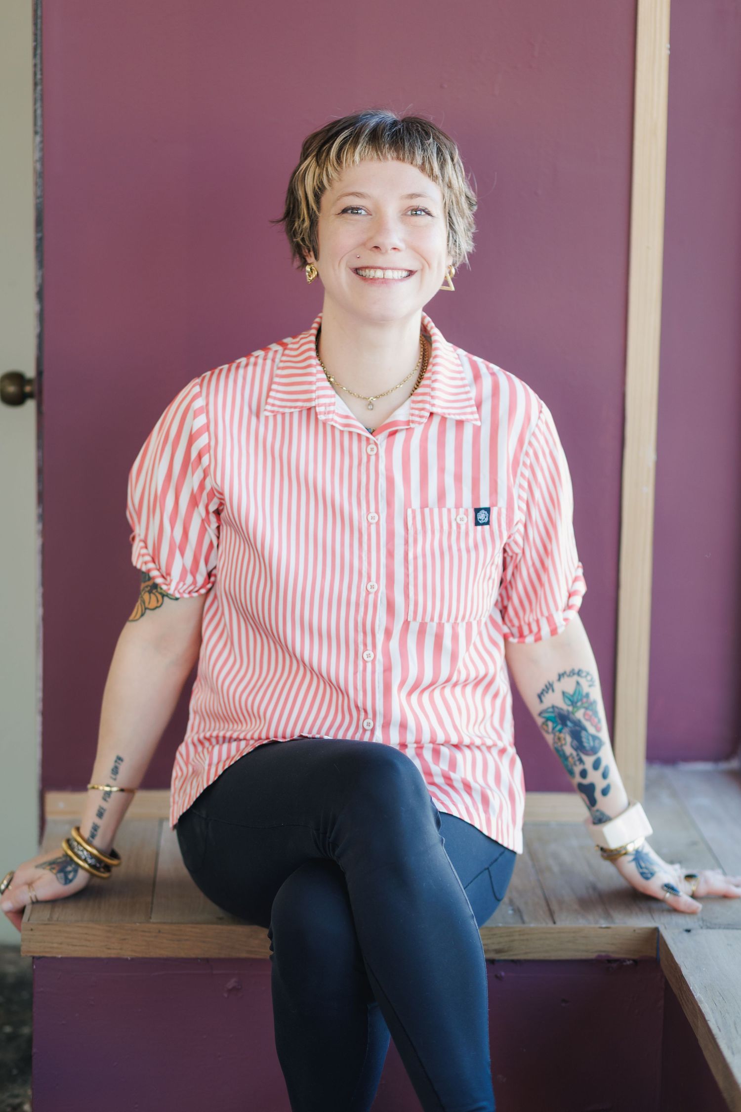 A series of four similar photos showing someone in a pink striped shirt and dark pants sitting on a wooden bench.