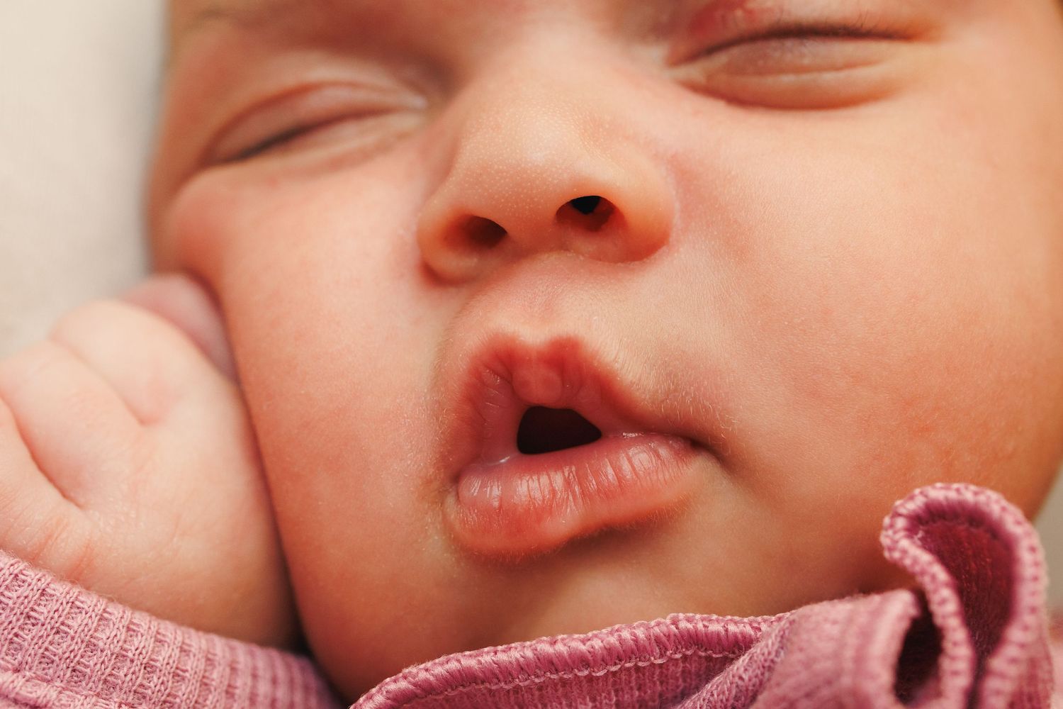 Close-up photo of a baby's face showing various sweet expressions and emotions.