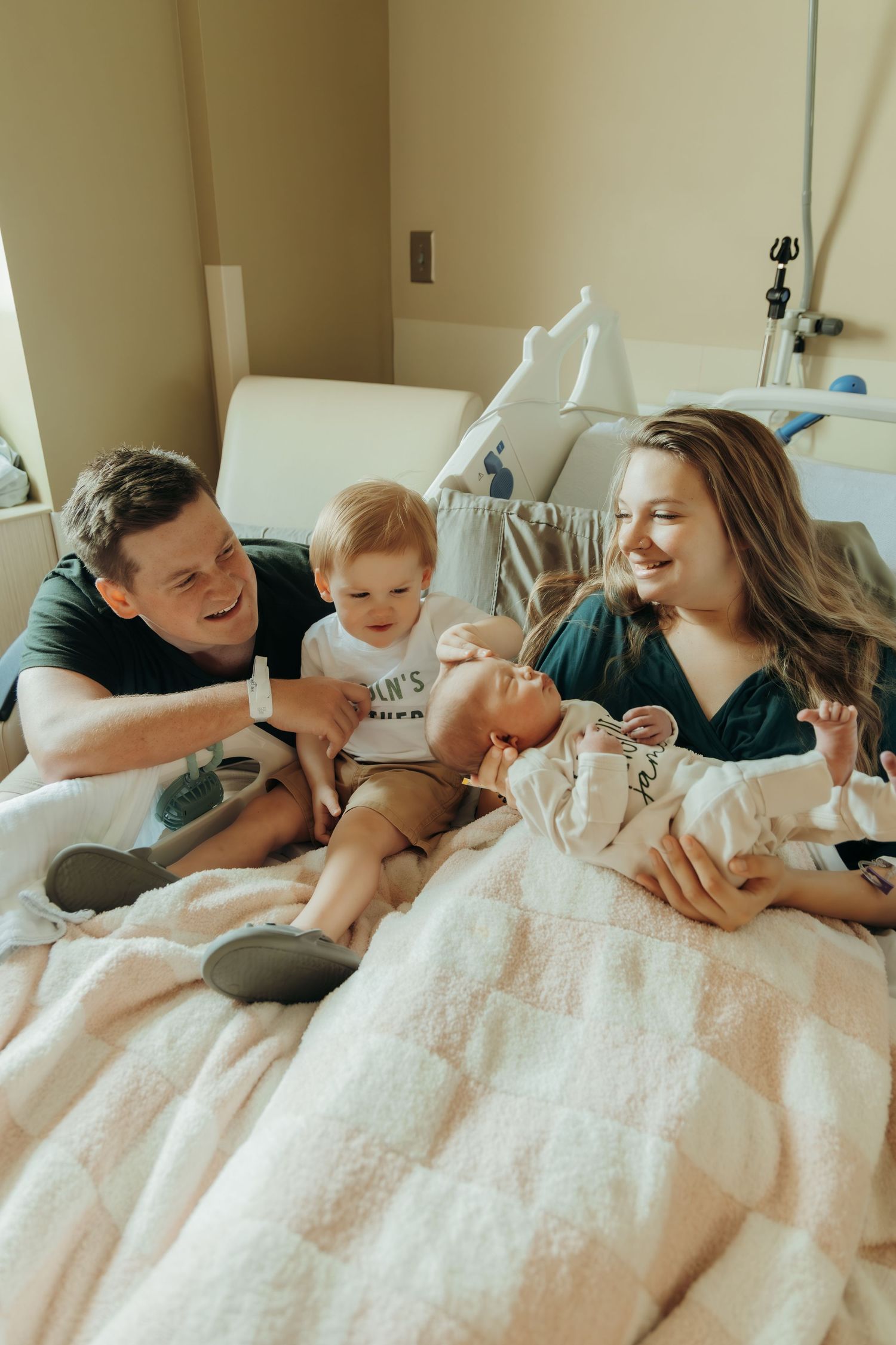A series of four intimate photos showing a mother nursing a baby in a hospital bed.