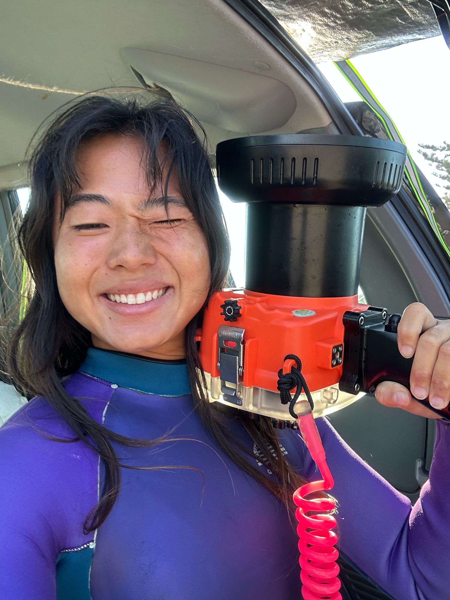 female ocean portrait photographer kanari based in Newcastle NSW posing with her underwater camera