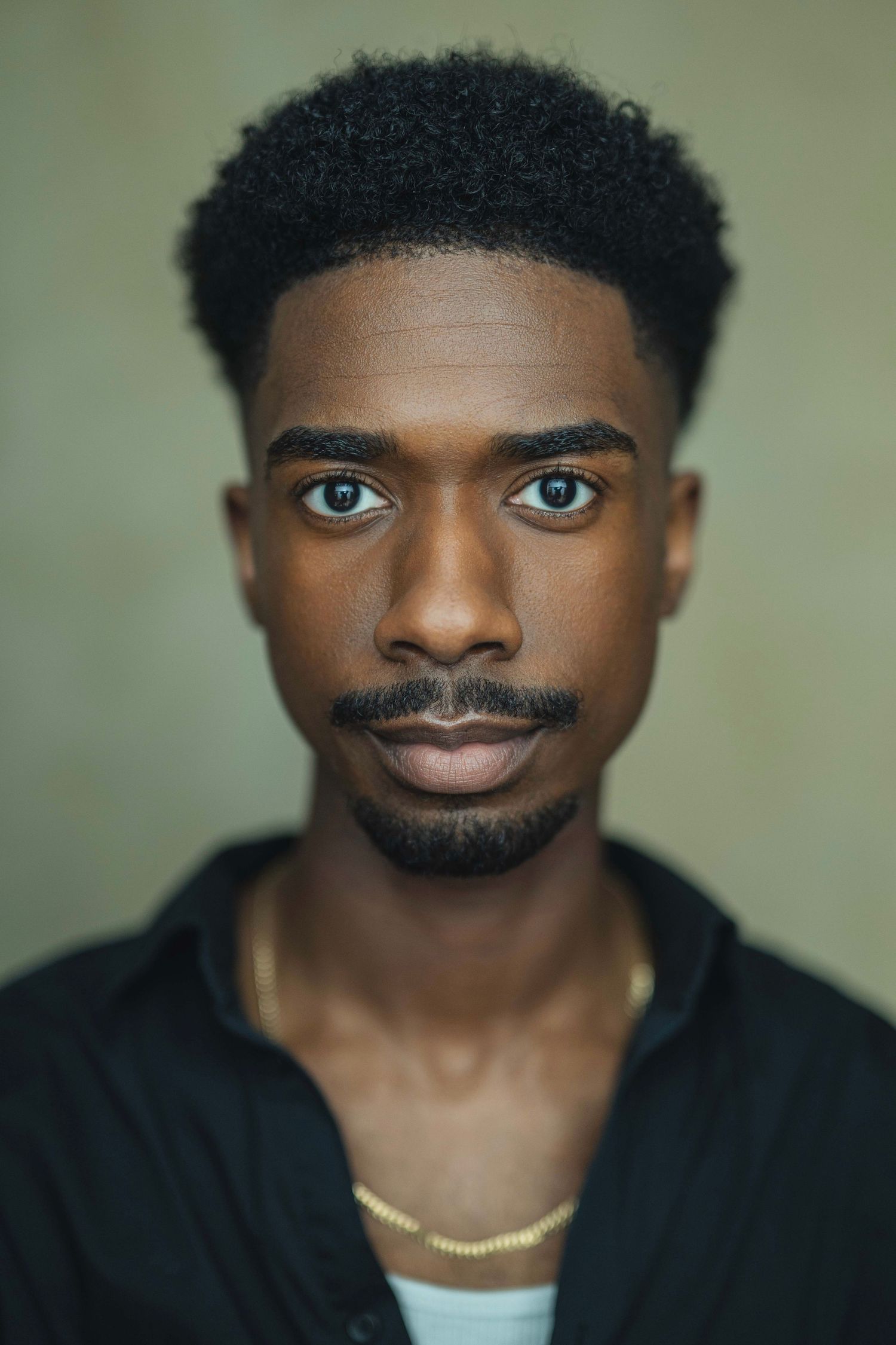 A series of expressive facial expressions showing different emotions and angles against a neutral background.