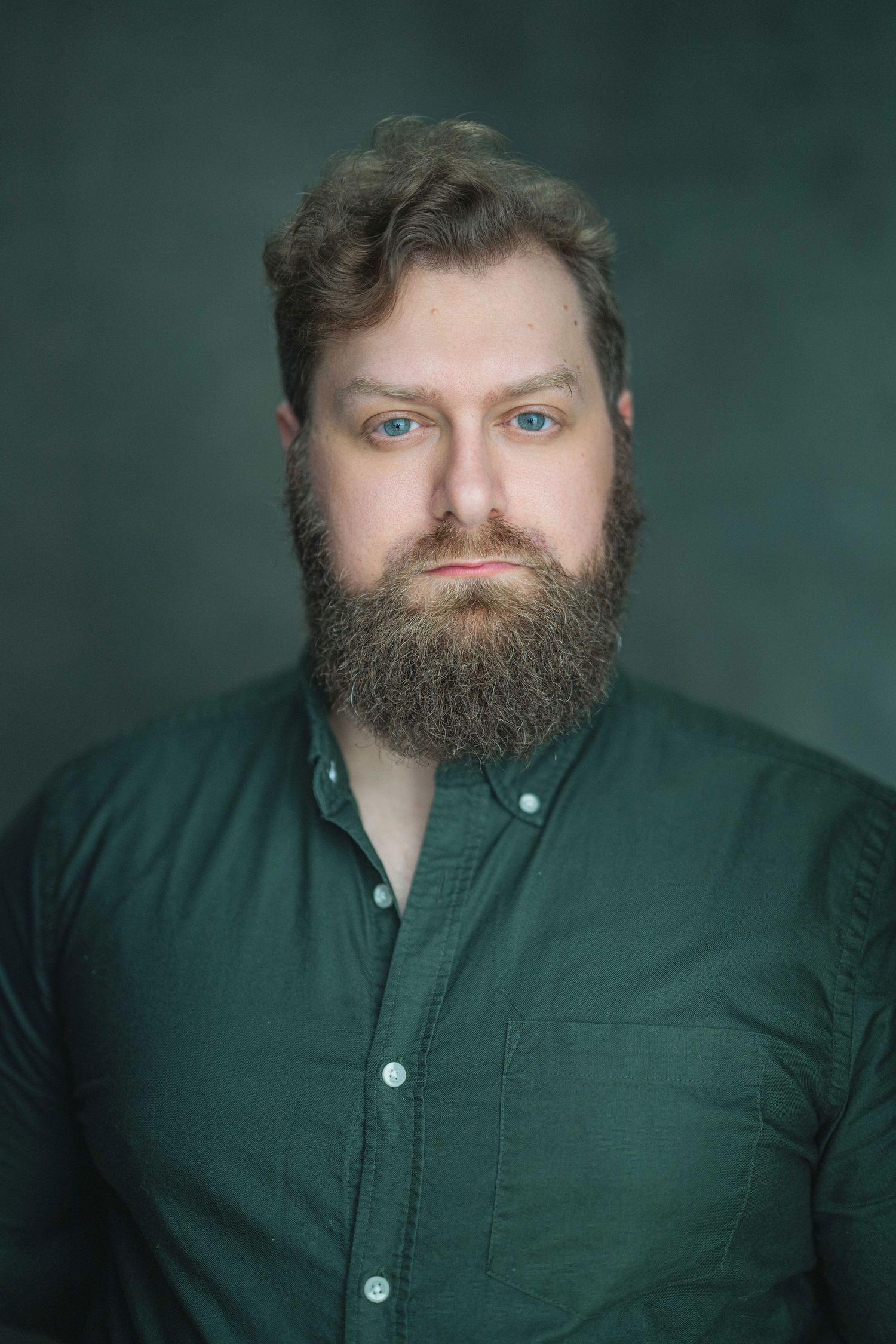 Portrait series showing different angles of a person with a full beard wearing a dark green button-up shirt.
