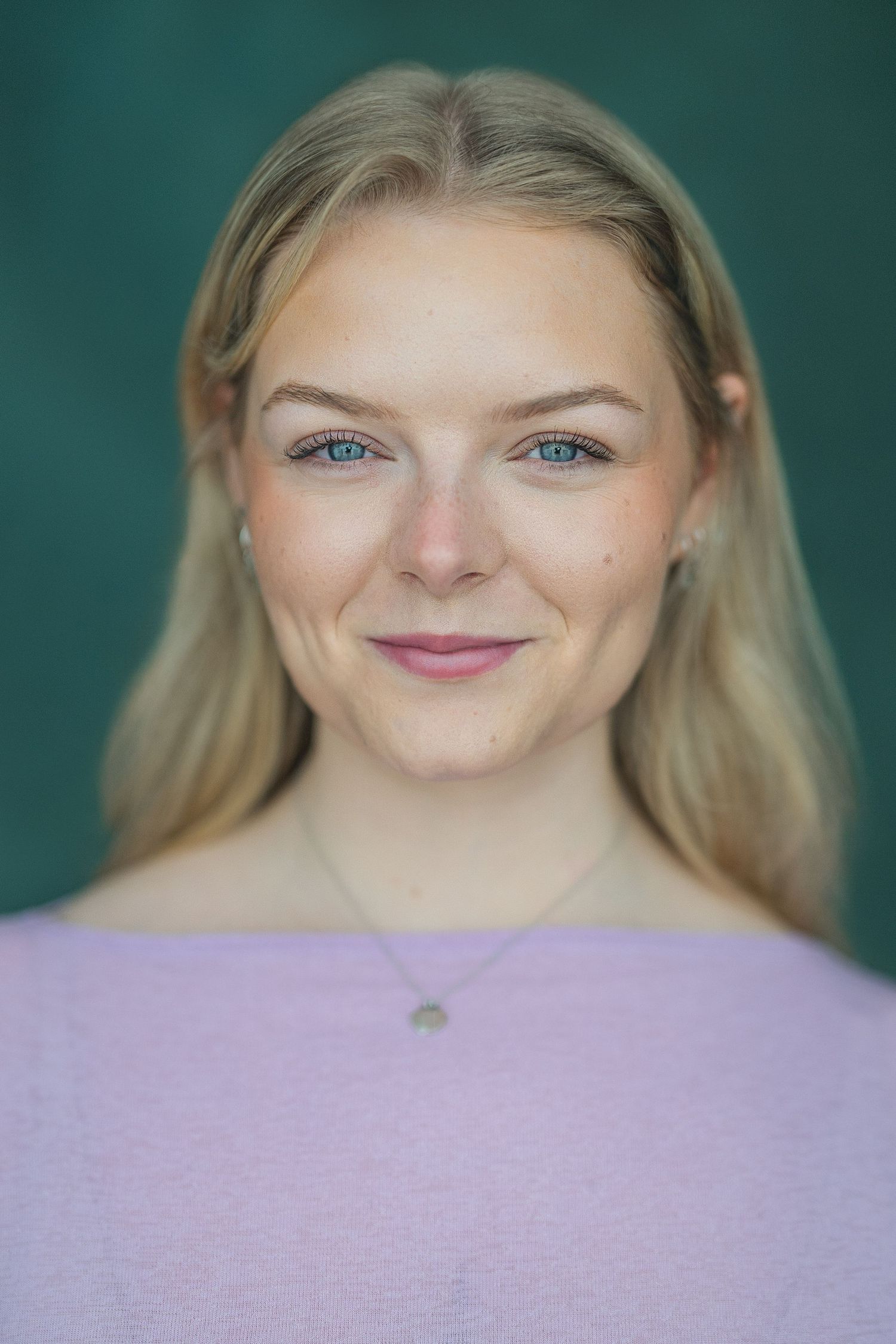A series of close-up portrait photos showing bright blue eyes and blonde hair against a teal background.