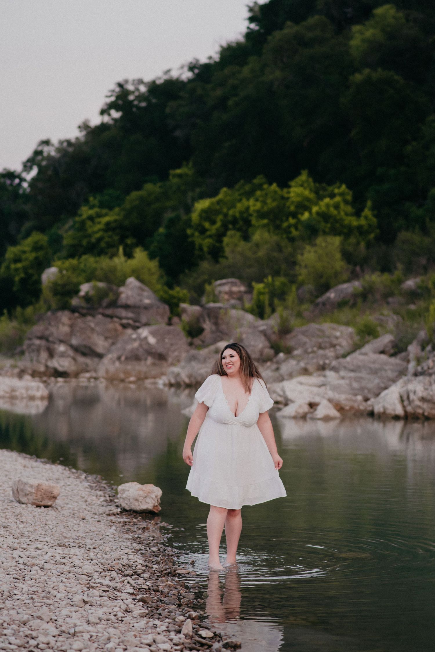 Senior girl in San Marcos, TX walking in a river