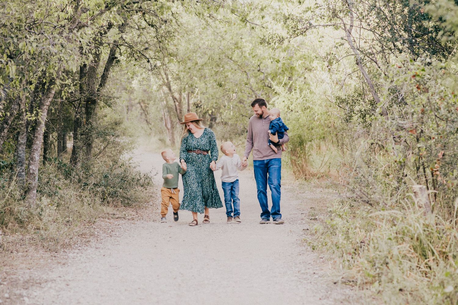 Family walking on a path in San Marcos, TX