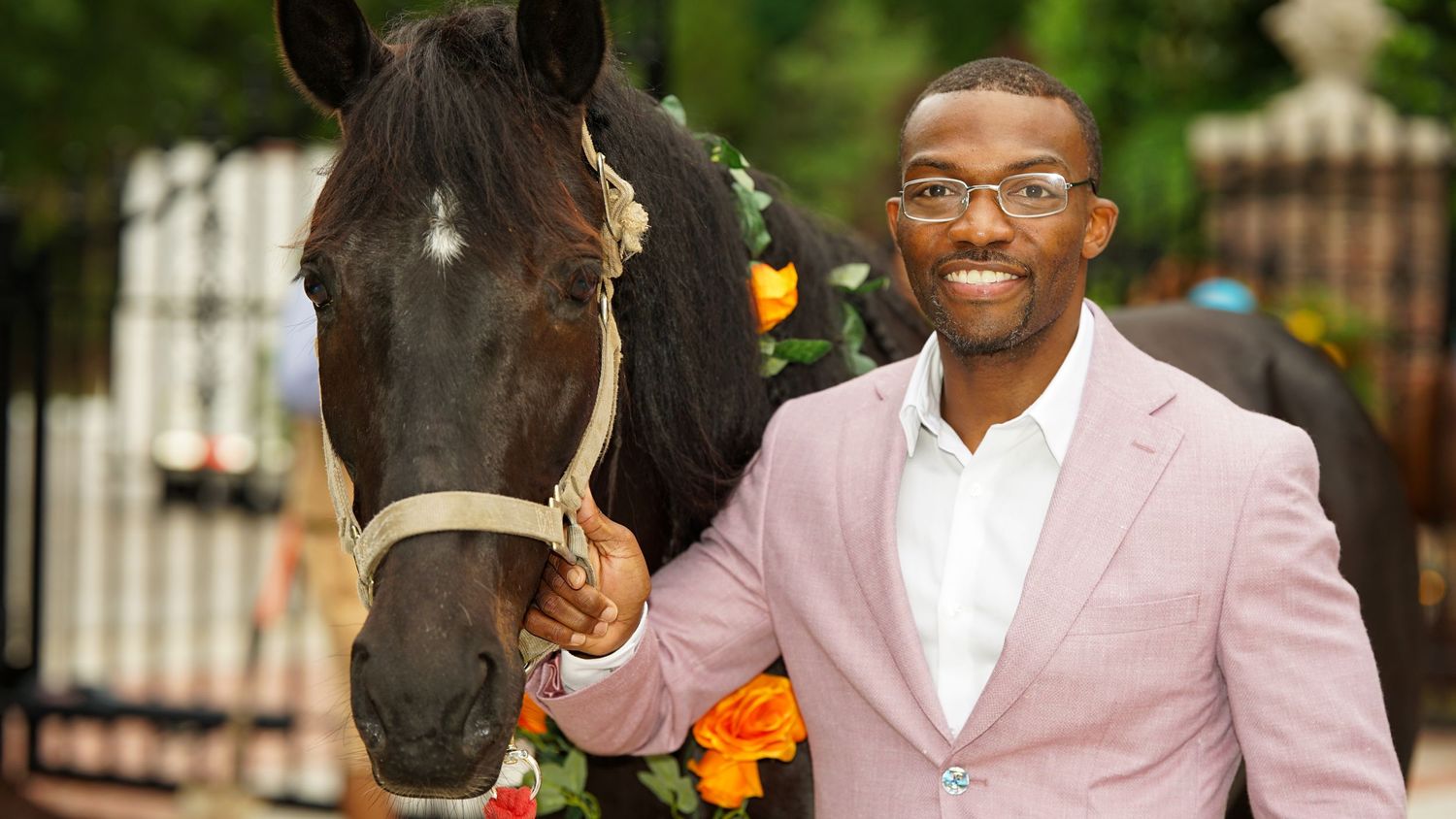 An outdoor celebration featuring horses and festive party decorations.