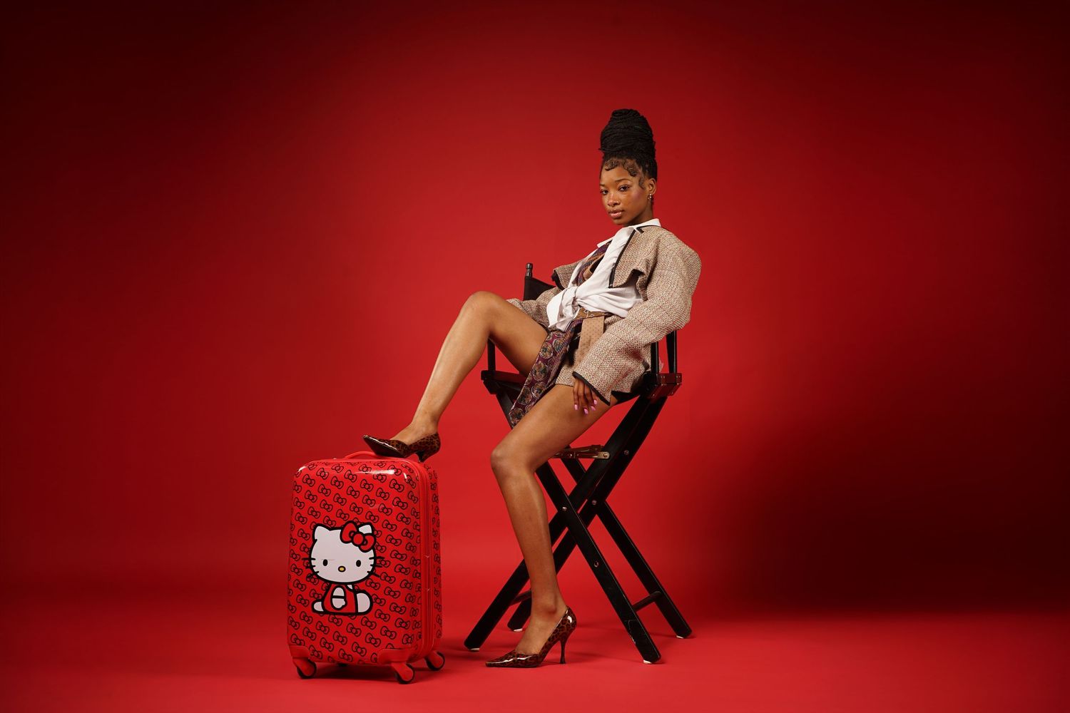 A collection of red-tinted fashion photographs featuring a model posing with Hello Kitty accessories against a crimson backdrop.