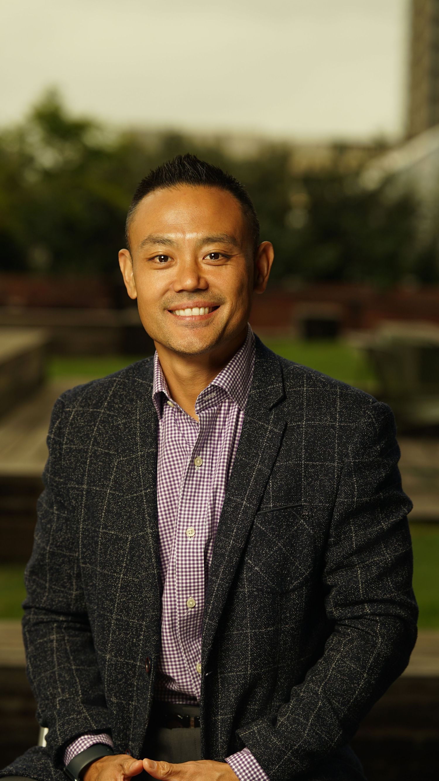 Professional portrait series showing a person in a checkered blazer and pink striped shirt against an outdoor background.