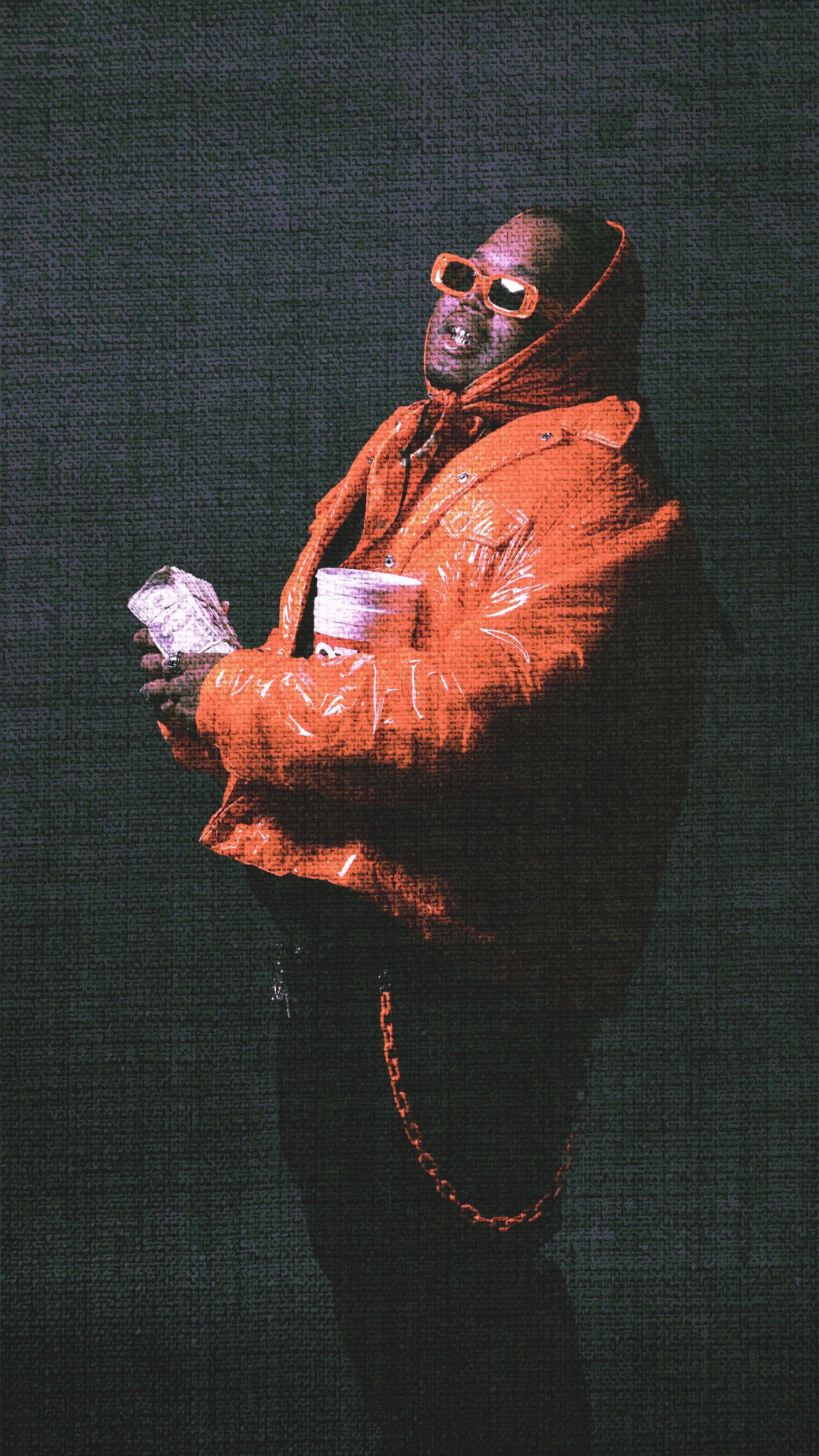 Figure in orange jacket creating dynamic motion blur effects against dark background.