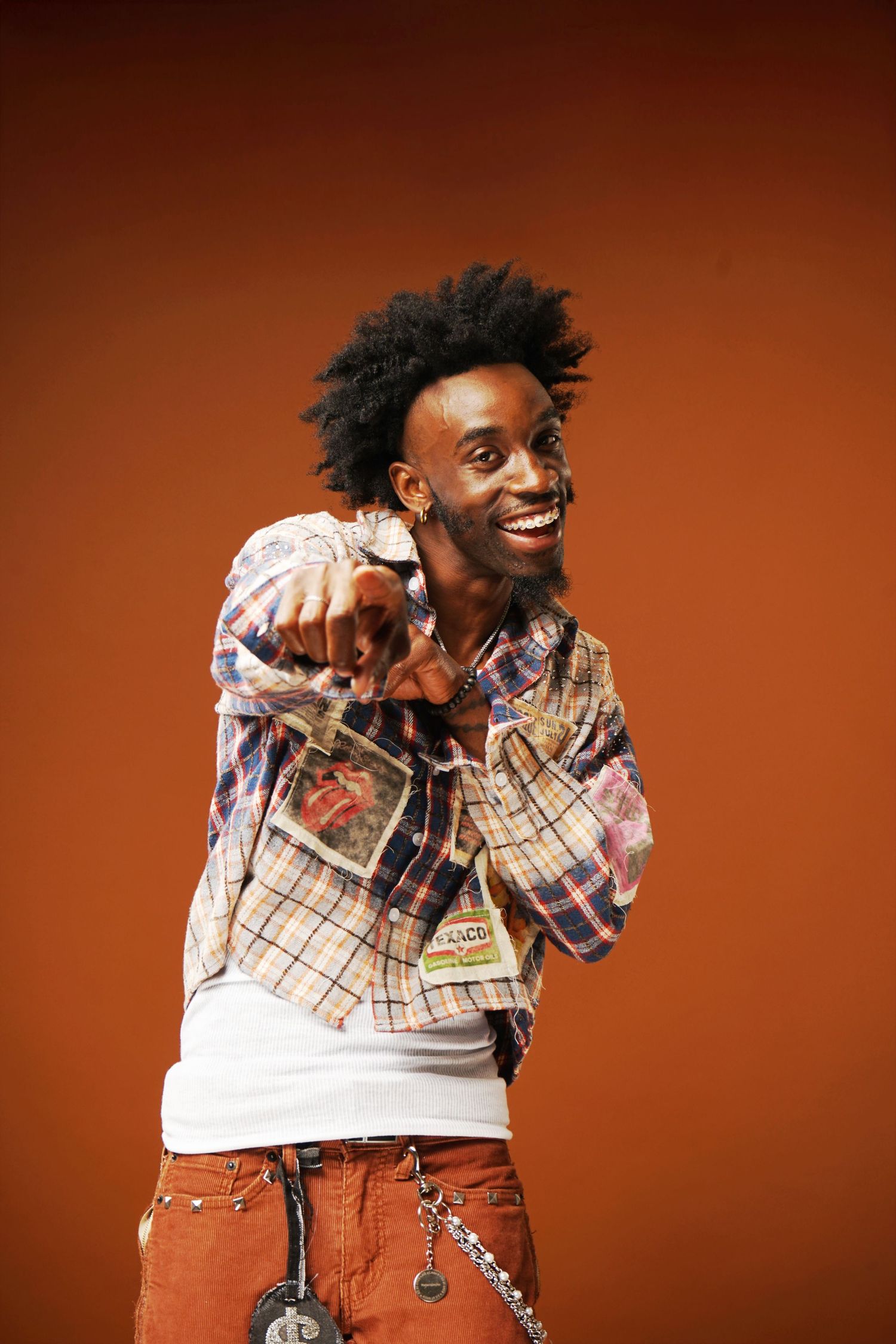 Animated poses of person in casual plaid outfit against vibrant orange backdrop.