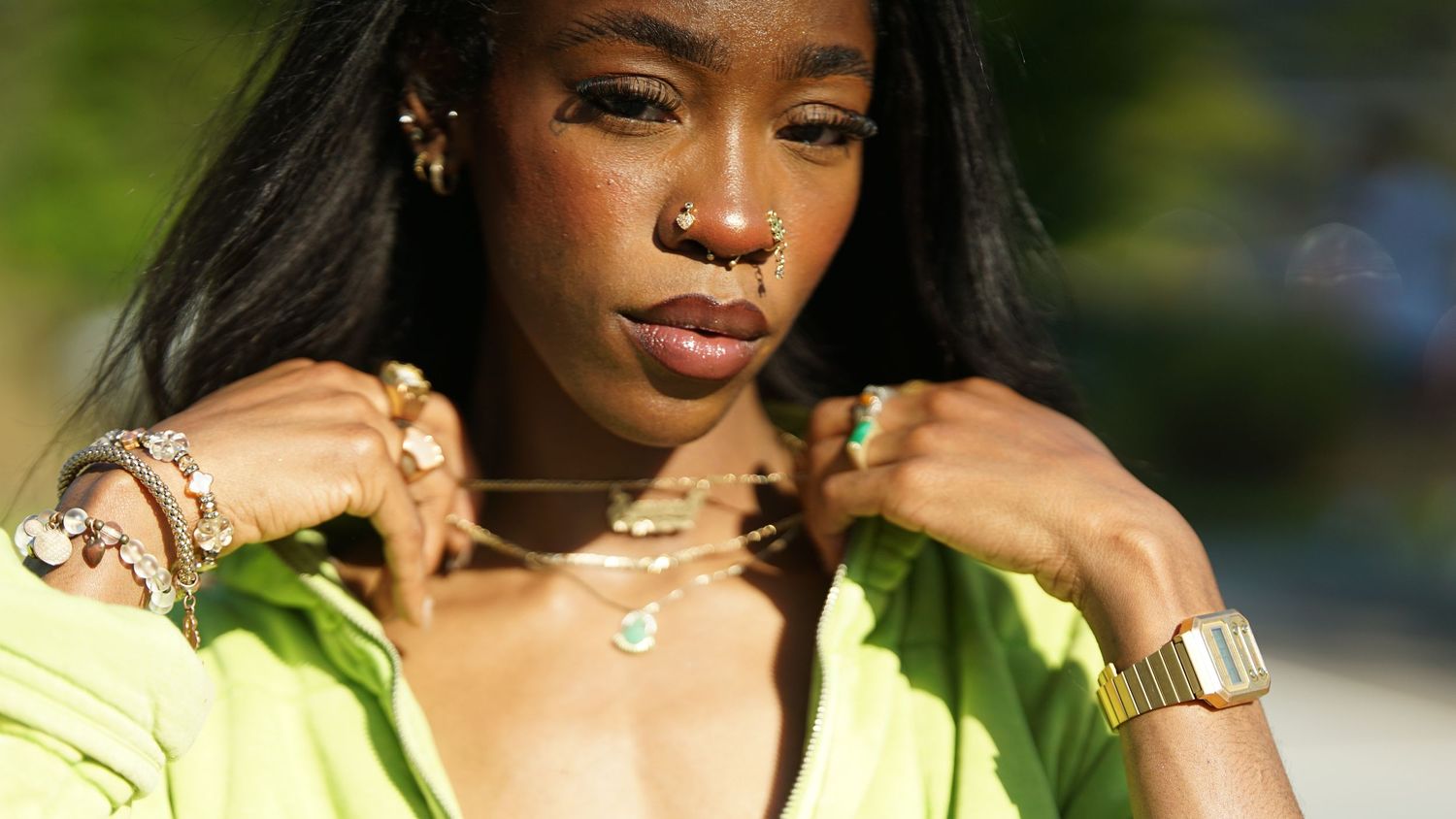 Close-up fashion portrait with delicate jewelry and natural lighting.