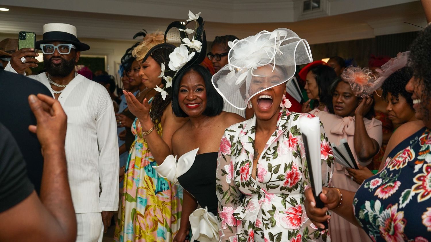 Candid party shots of guests enjoying themselves at an indoor celebration.