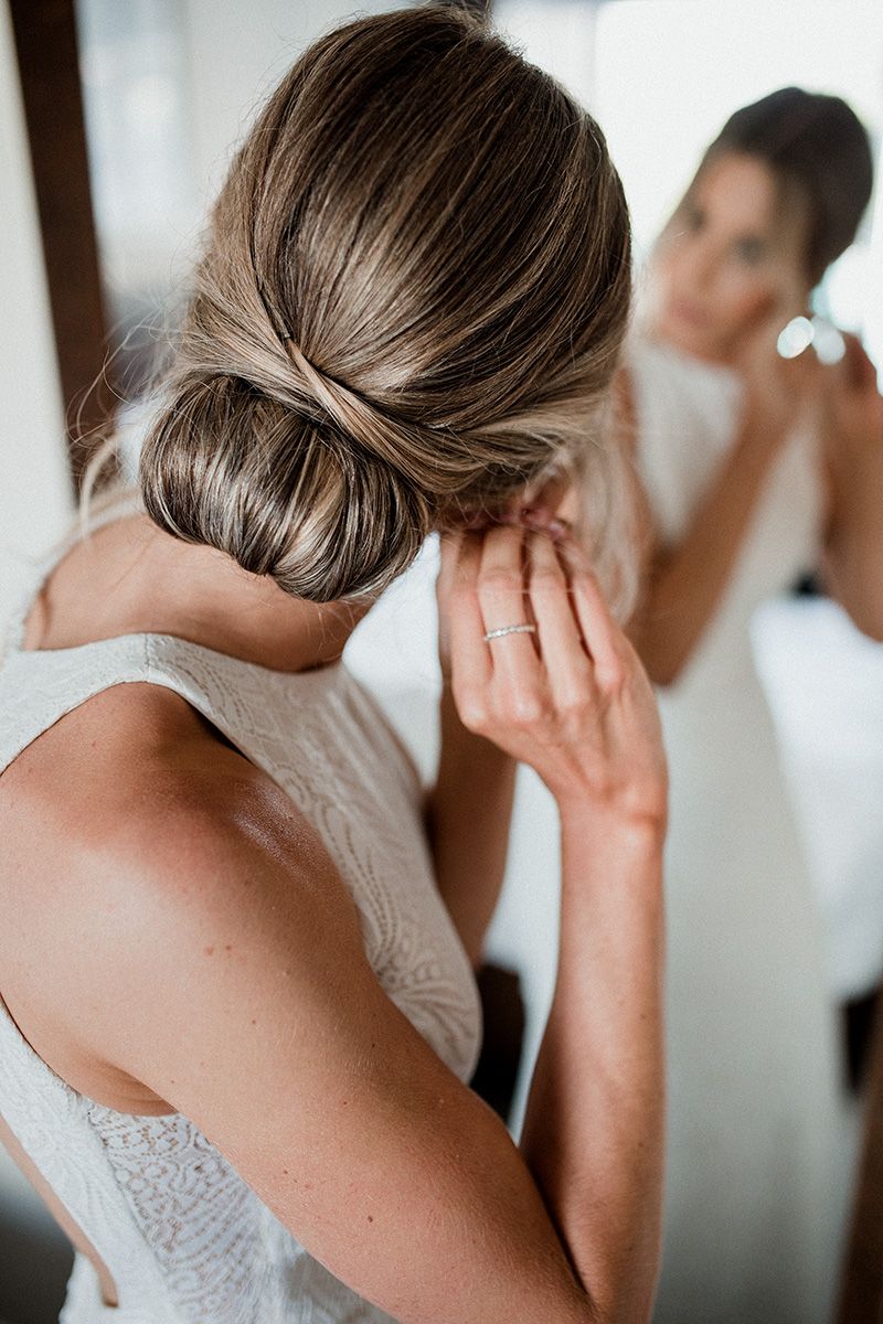 Series of profile views showing a woman's elegant updo hairstyle with twisted sections and soft waves from different angles.
