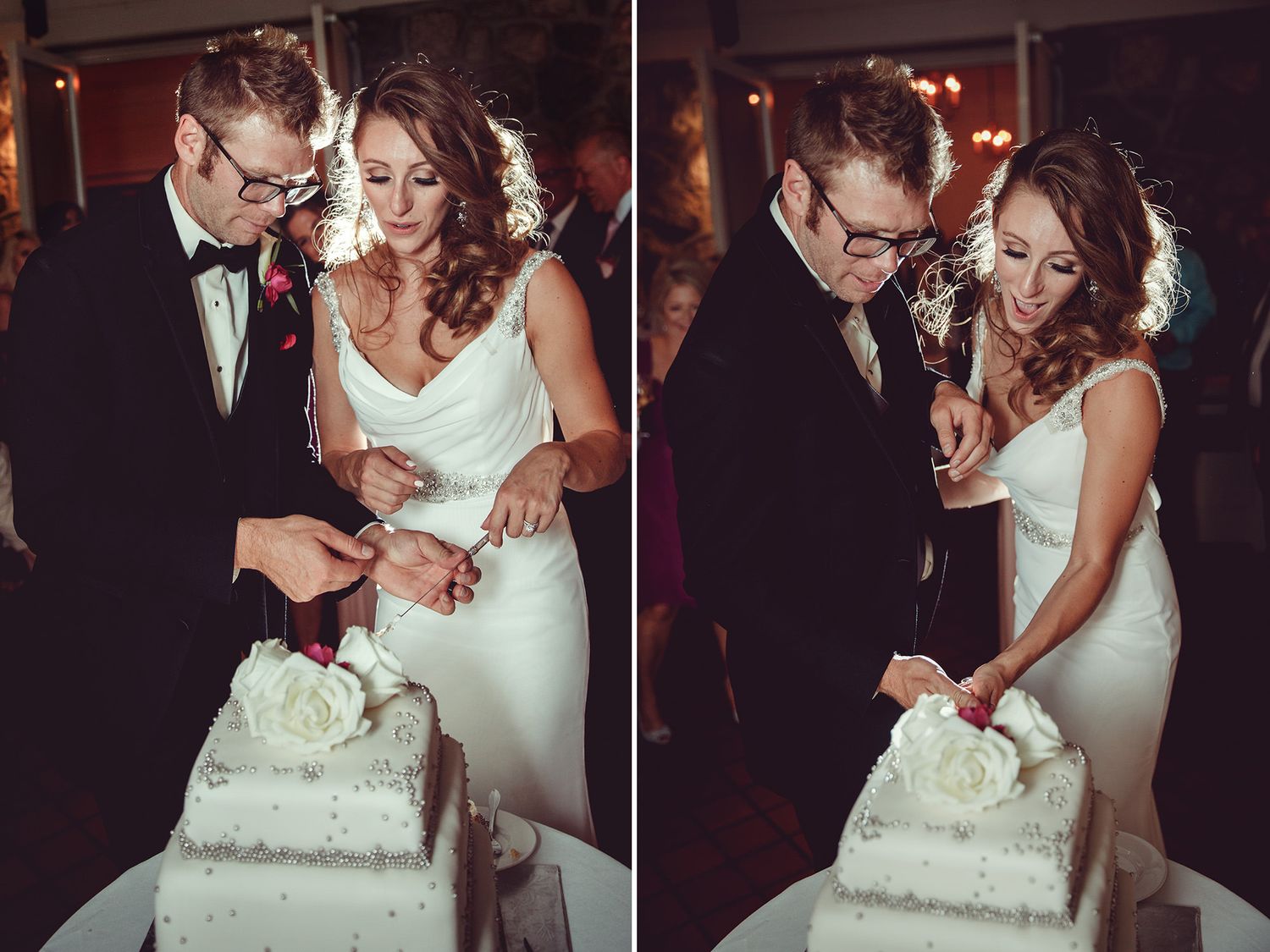 Newlyweds cut their elegant white wedding cake together during their romantic reception celebration.