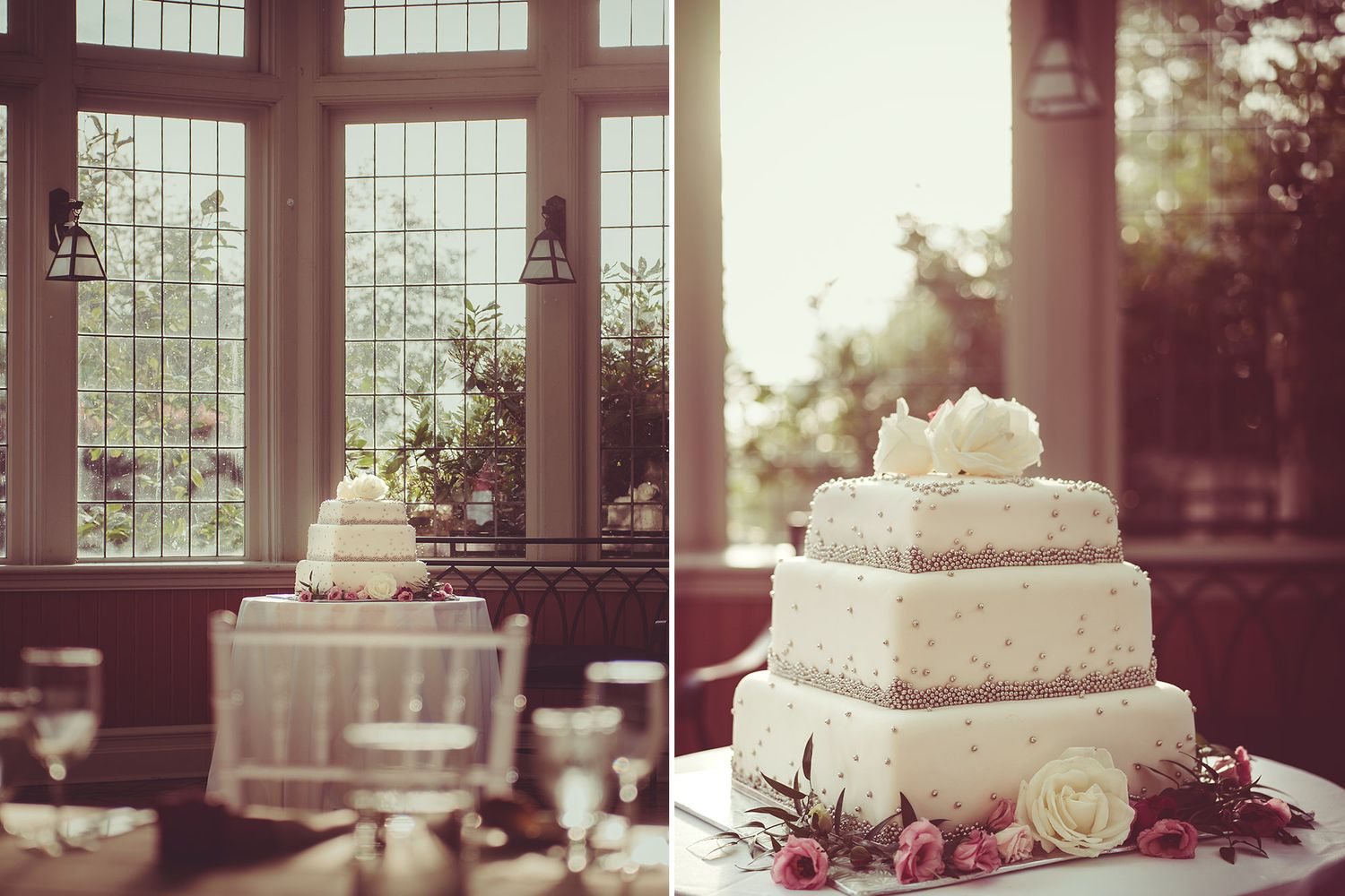 Elegant wedding reception venue with floor-to-ceiling windows and a tiered white cake decorated with roses.