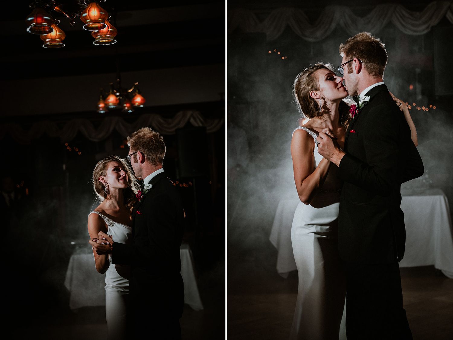 A couple dances together in dramatic lighting during their wedding reception.
