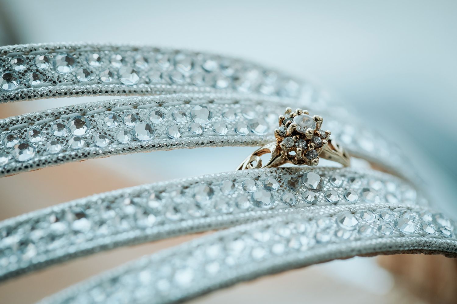 Close-up macro shots of a sparkling diamond engagement ring band with intricate pave setting details.