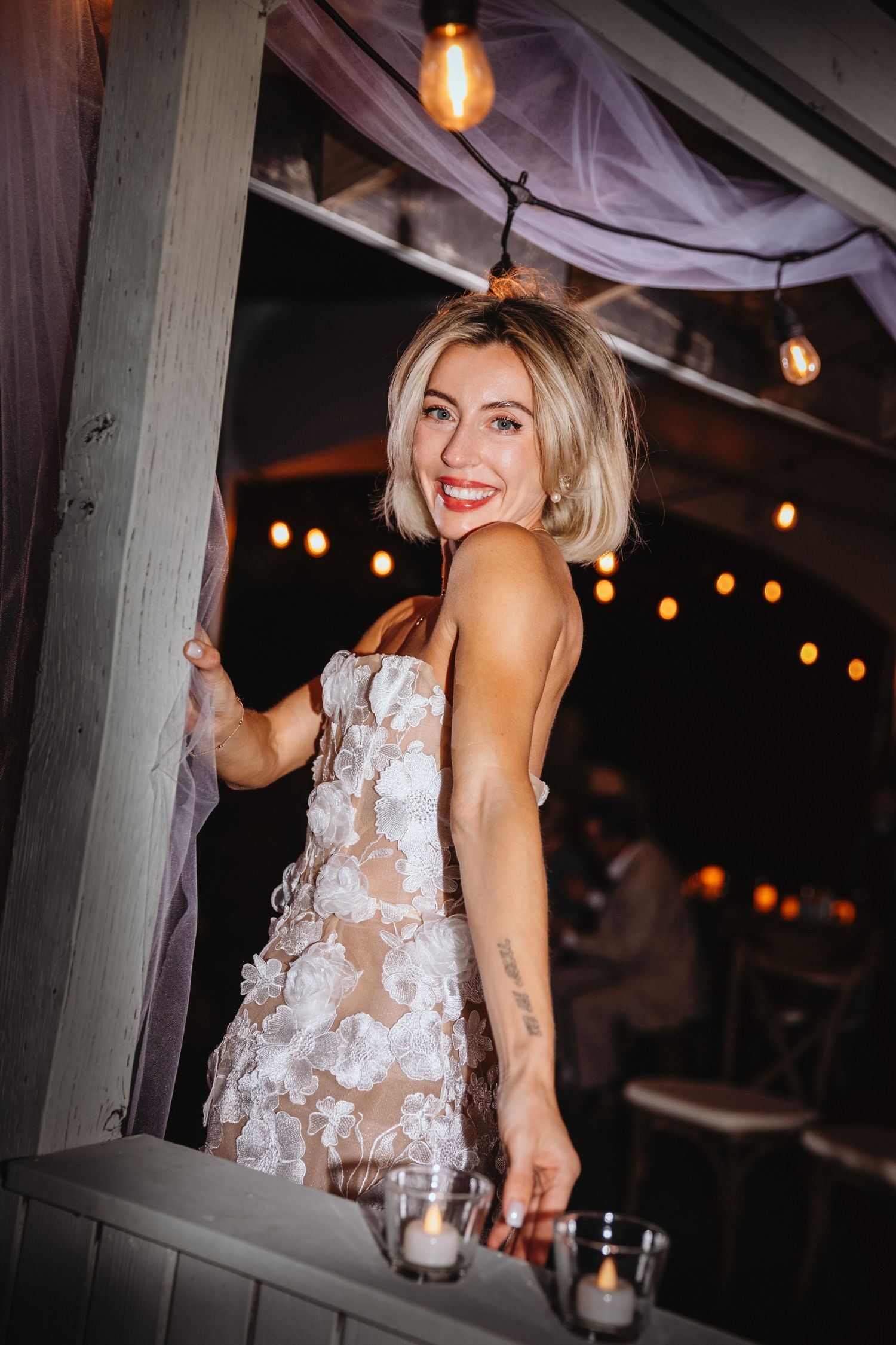 Using on-camera flash to take a quick impromptu portrait of a bride just after changing into her party dress.