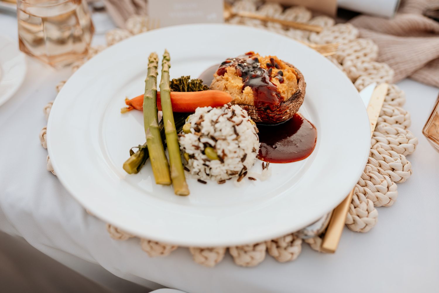 Elegant plated dishes featuring gourmet cuisine with delicate garnishes on white plates arranged in a stylish presentation.