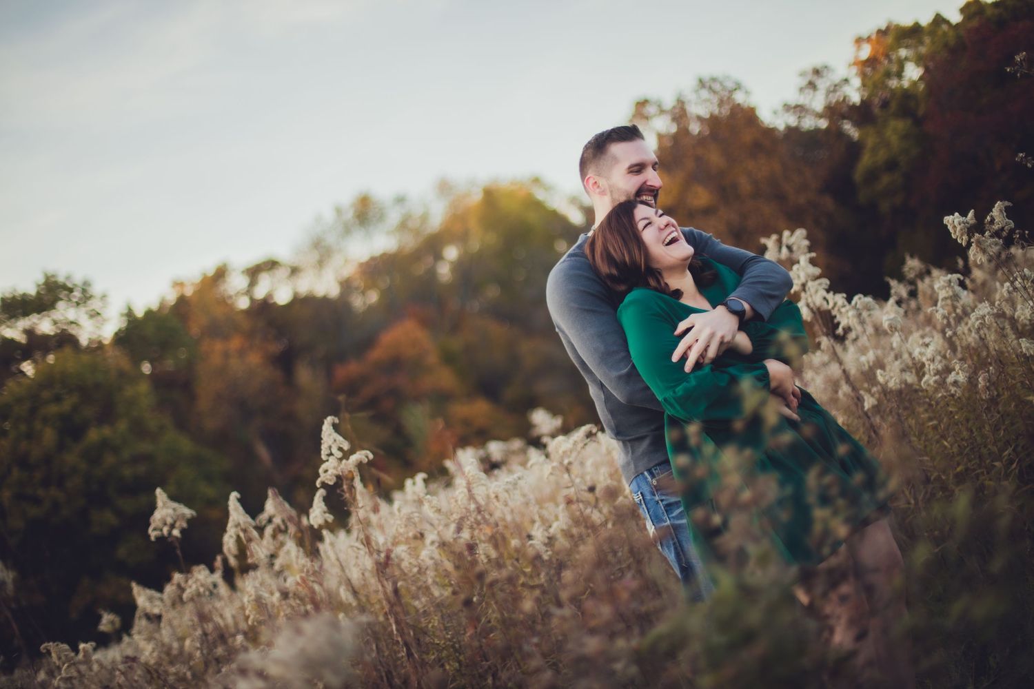Intimate outdoor portrait session featuring natural light and fall foliage.