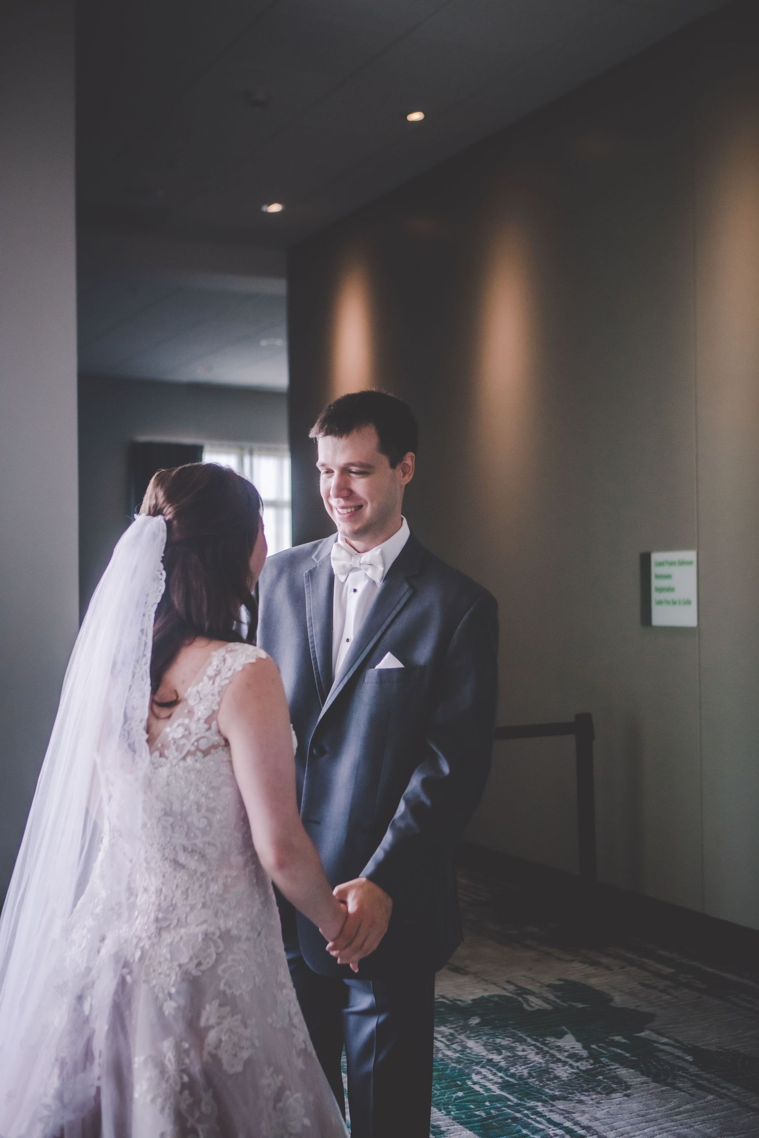 The newlyweds share genuine smiles during their wedding celebration.