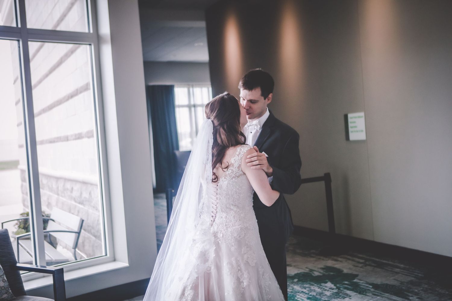 The couple shares a romantic dance in their elegant wedding attire.