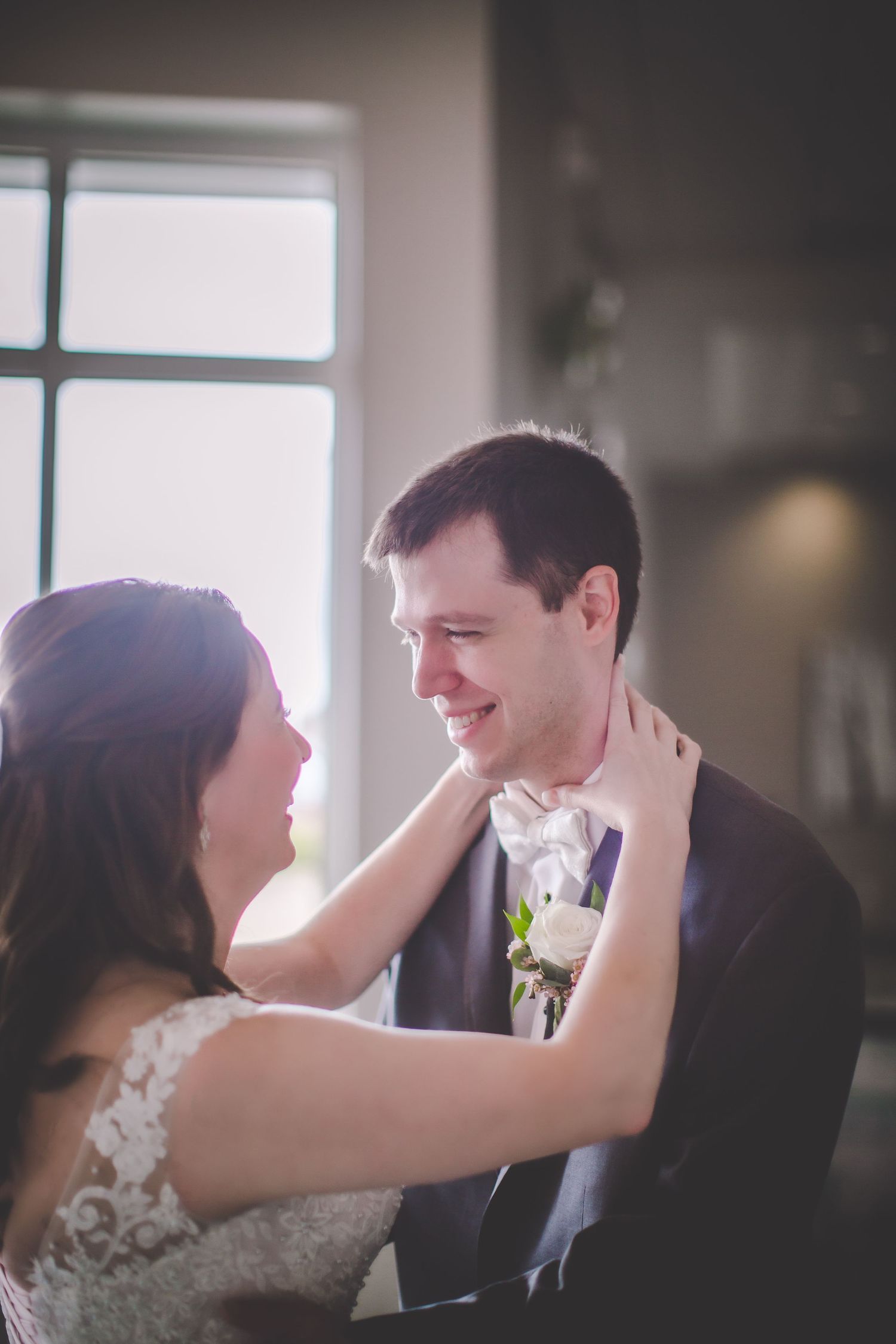 An affectionate moment between newlyweds during their wedding celebration.