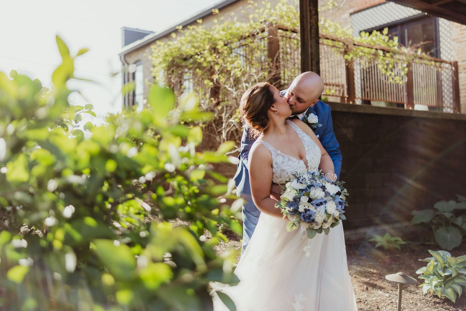 A series of romantic wedding photos taken in a lush garden setting with natural light.
