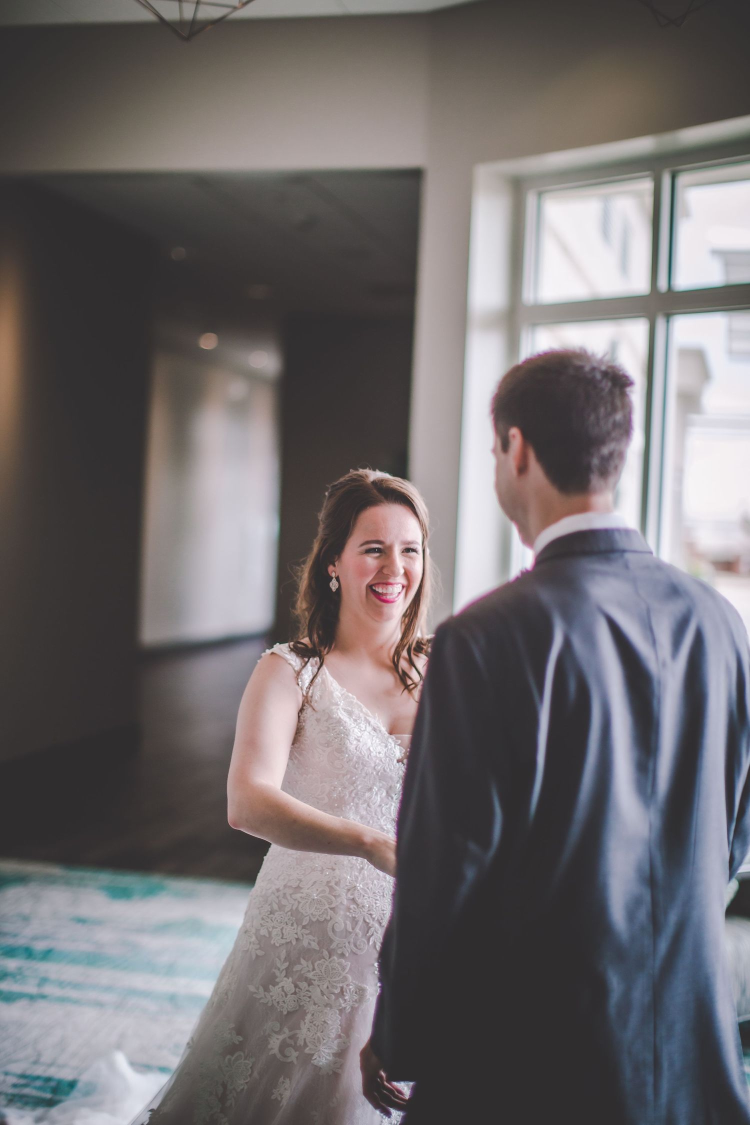 Emotional first look wedding sequence captured in natural window light.