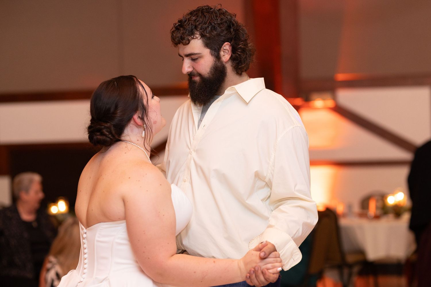 Couple sharing an intimate dance moment at their wedding reception.
