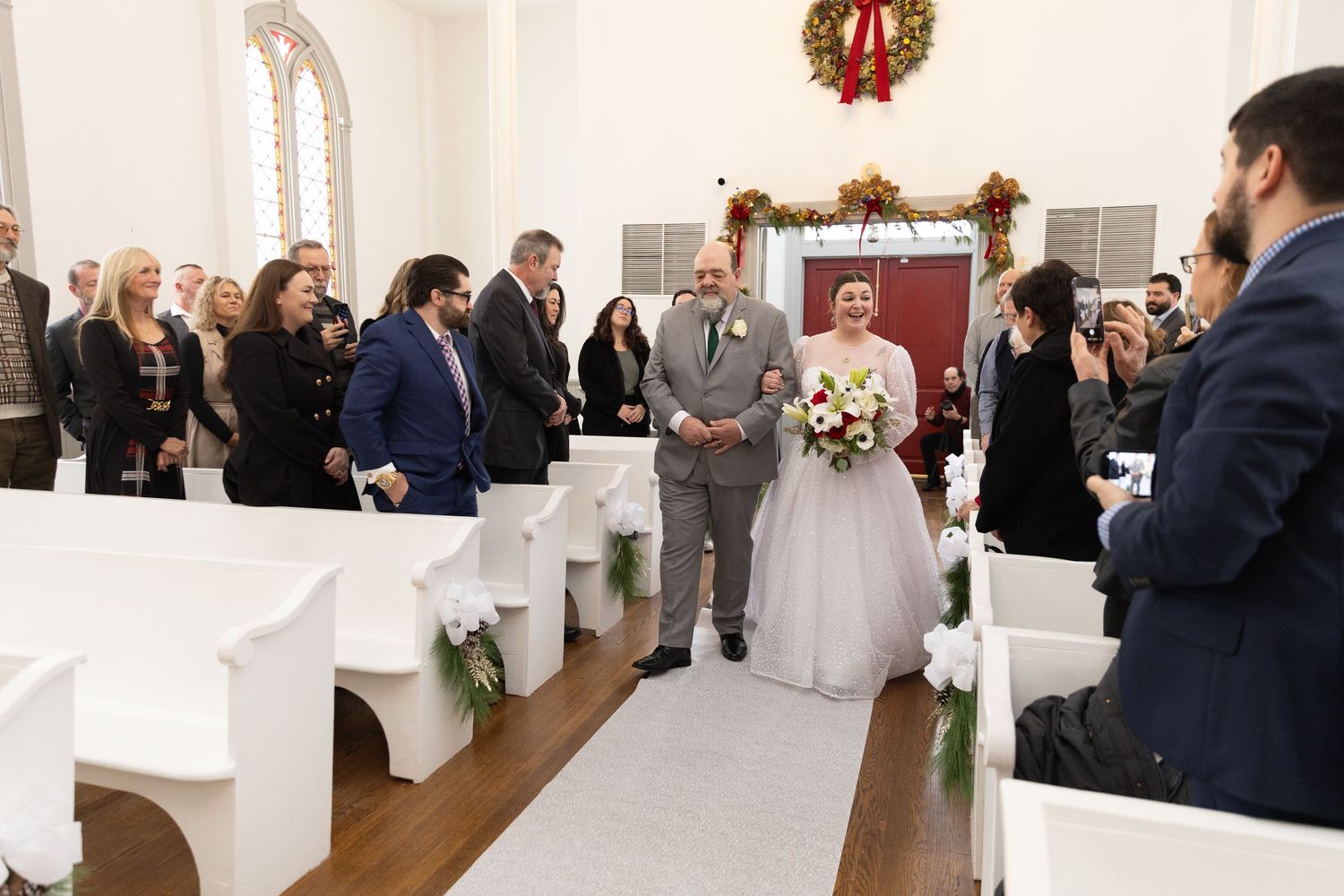 Indoor wedding ceremony at St. James Meeting House in Boardman, Ohio captured by Sarah Marie Studio
