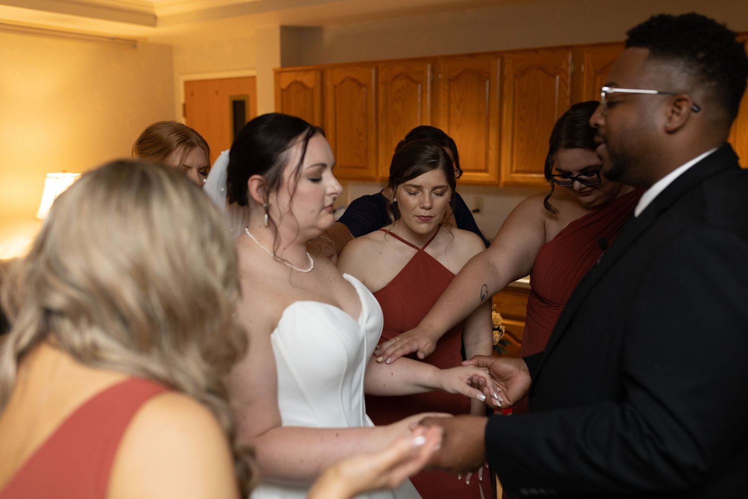 Wedding party members interacting during preparation moments.