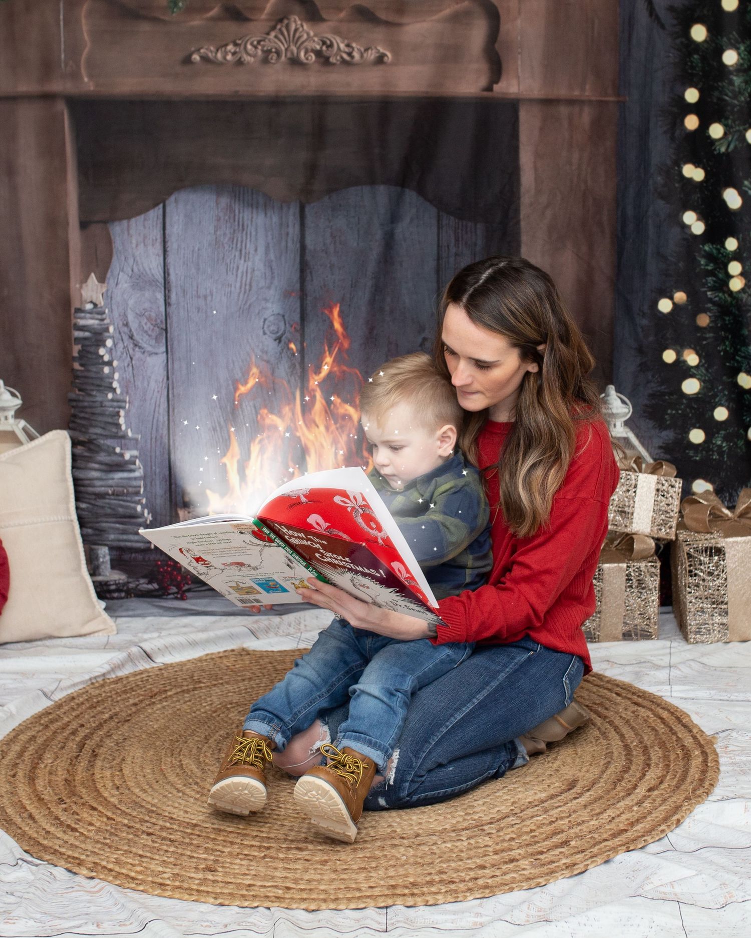 A cozy scene of reading time by a fireplace with holiday decorations and a round jute rug.