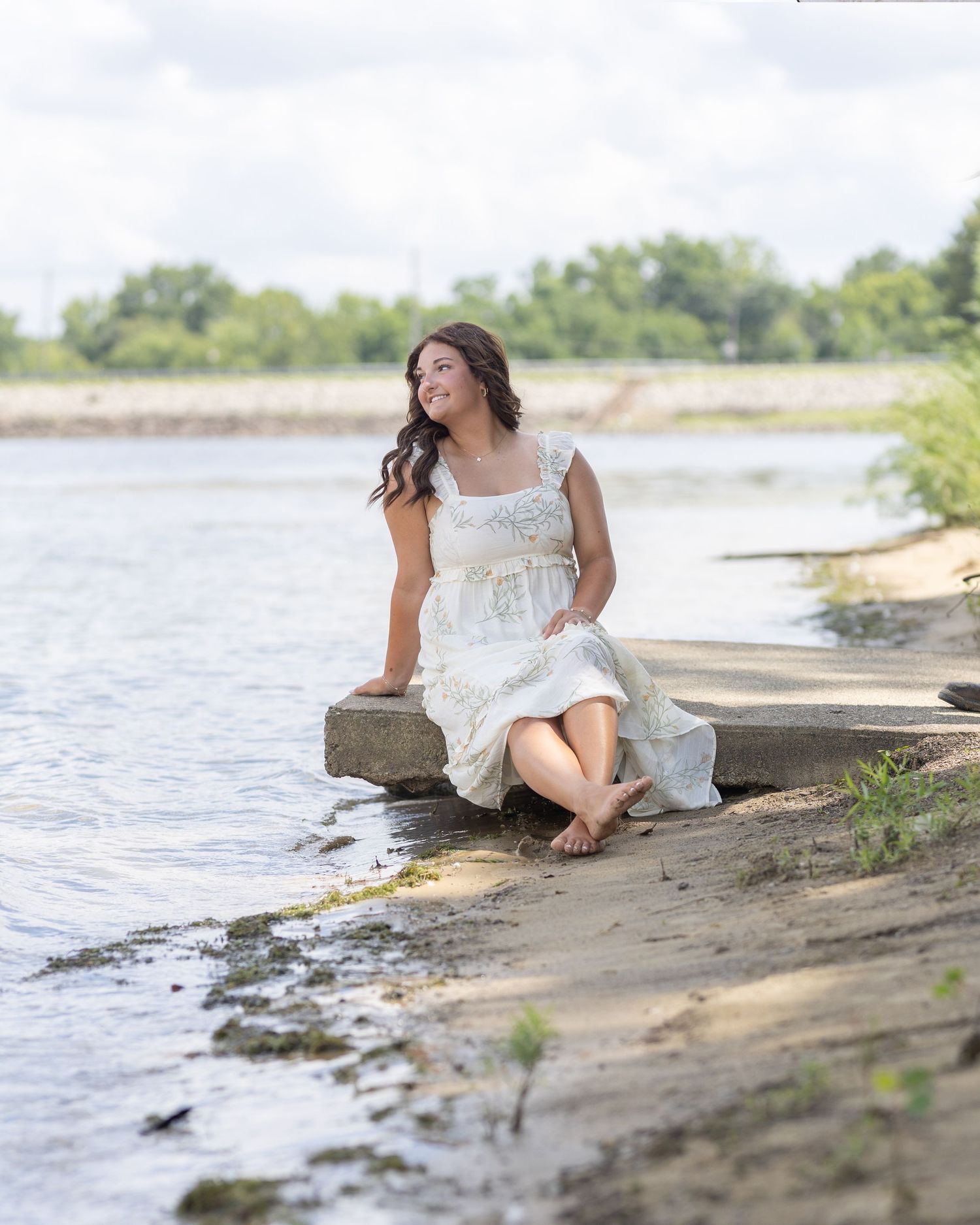 High school senior girl laughing during a sunset portrait session in Youngstown, Ohio