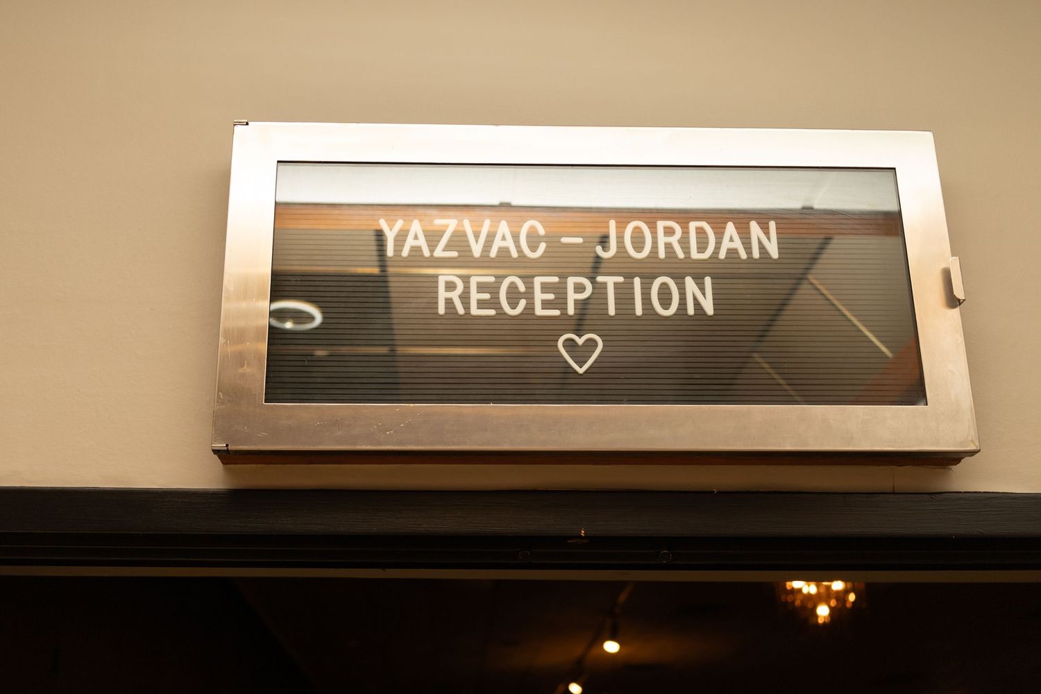 Wedding reception signage and directional markers in white frames.
