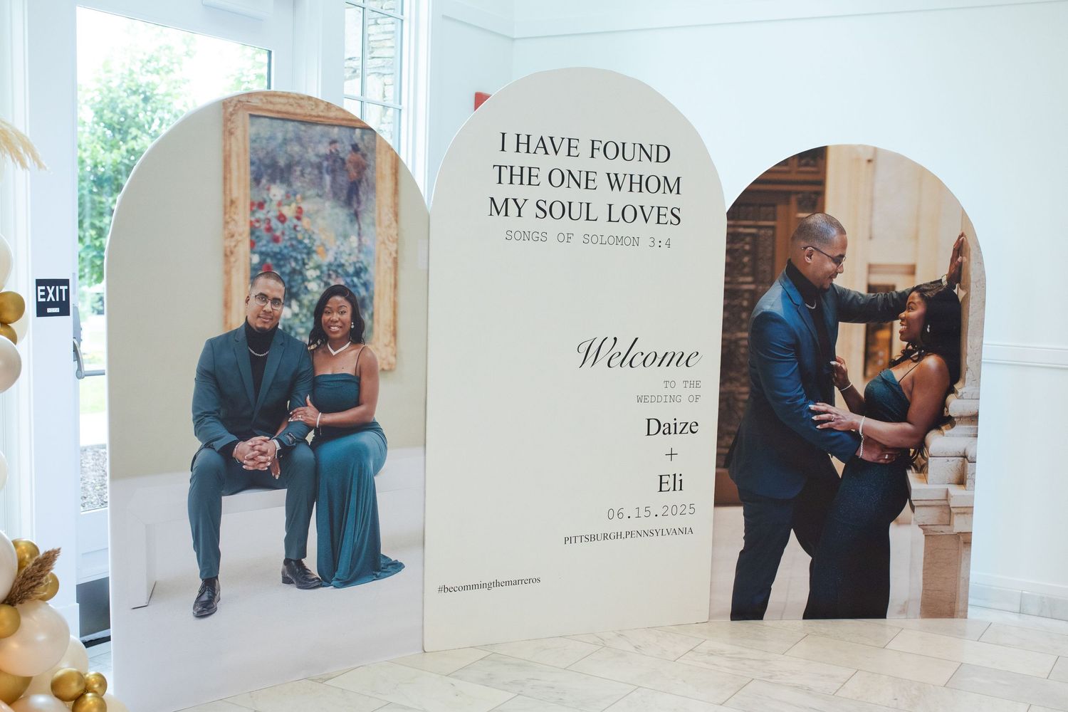 Wedding welcome display with arched panels and romantic quote about finding true love.