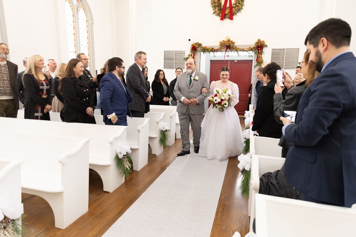 Indoor wedding ceremony at St. James Meeting House in Boardman, Ohio captured by Sarah Marie Studio