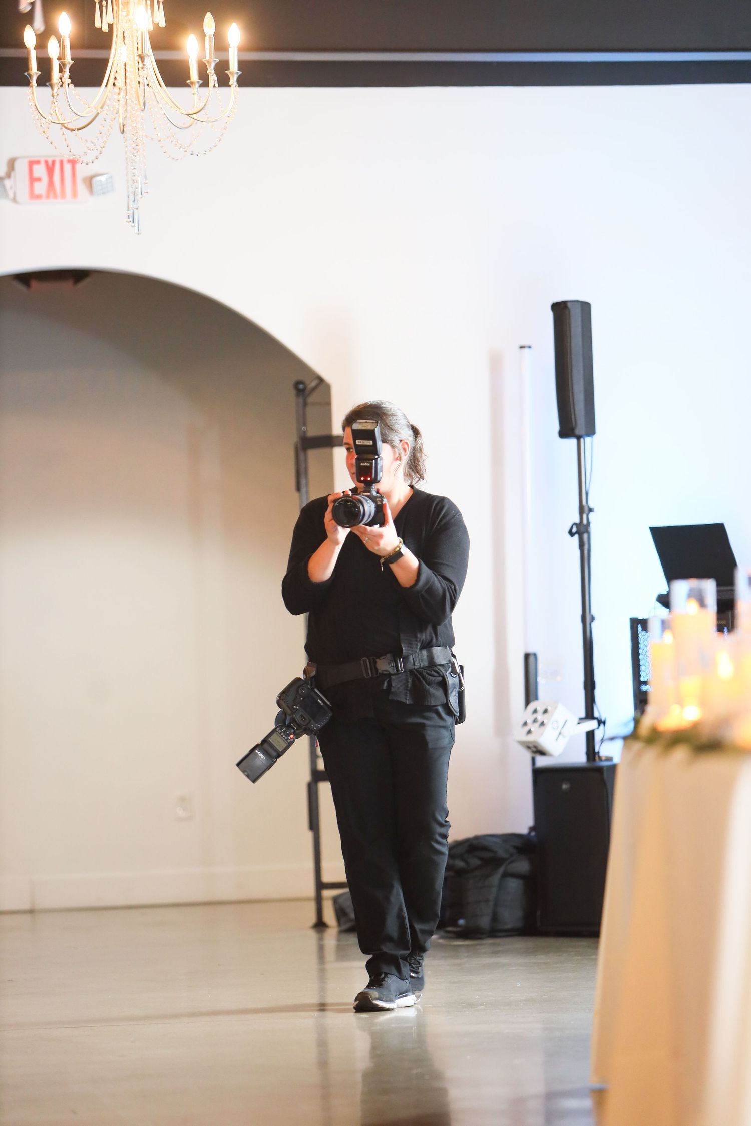 Sarah Marie Studio, a Youngstown wedding photographer, capturing a candid moment during a winter reception in girard ohio.