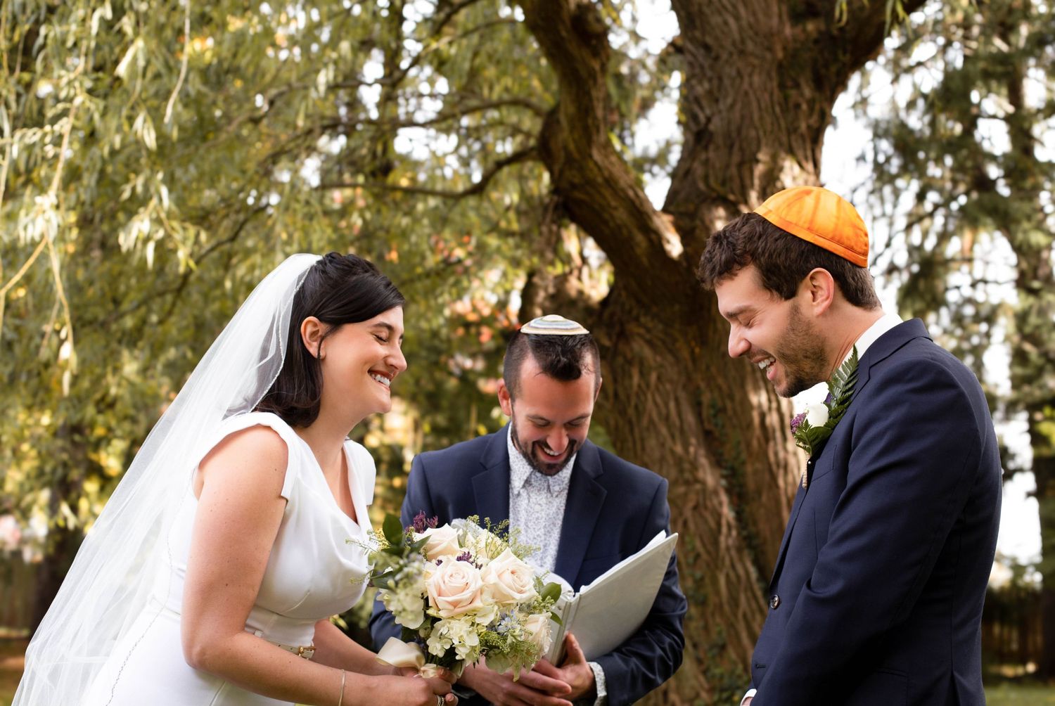 couple laughing during vows, beautiful fall wedding, backyard and so much joy. Natural colors and film editing. NYC